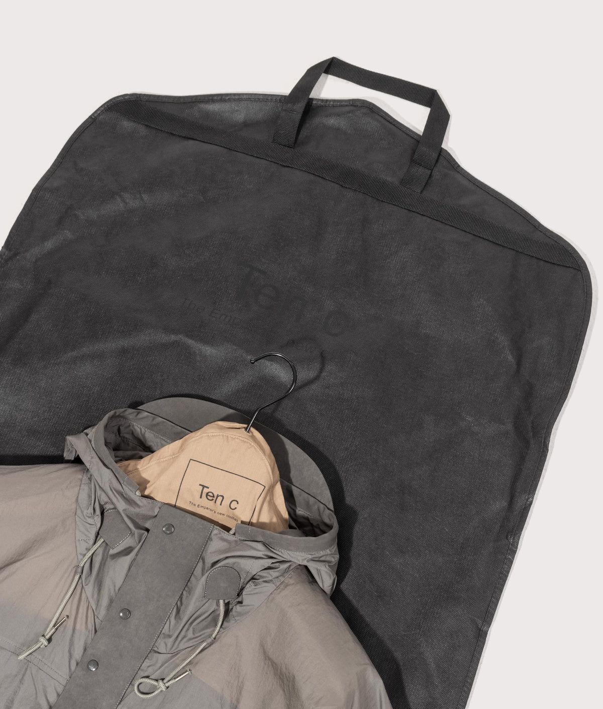 Skye Ten Anorak Jacket by Ten c in Iron Grey. Shot by EQVVS. Dust bag shot.