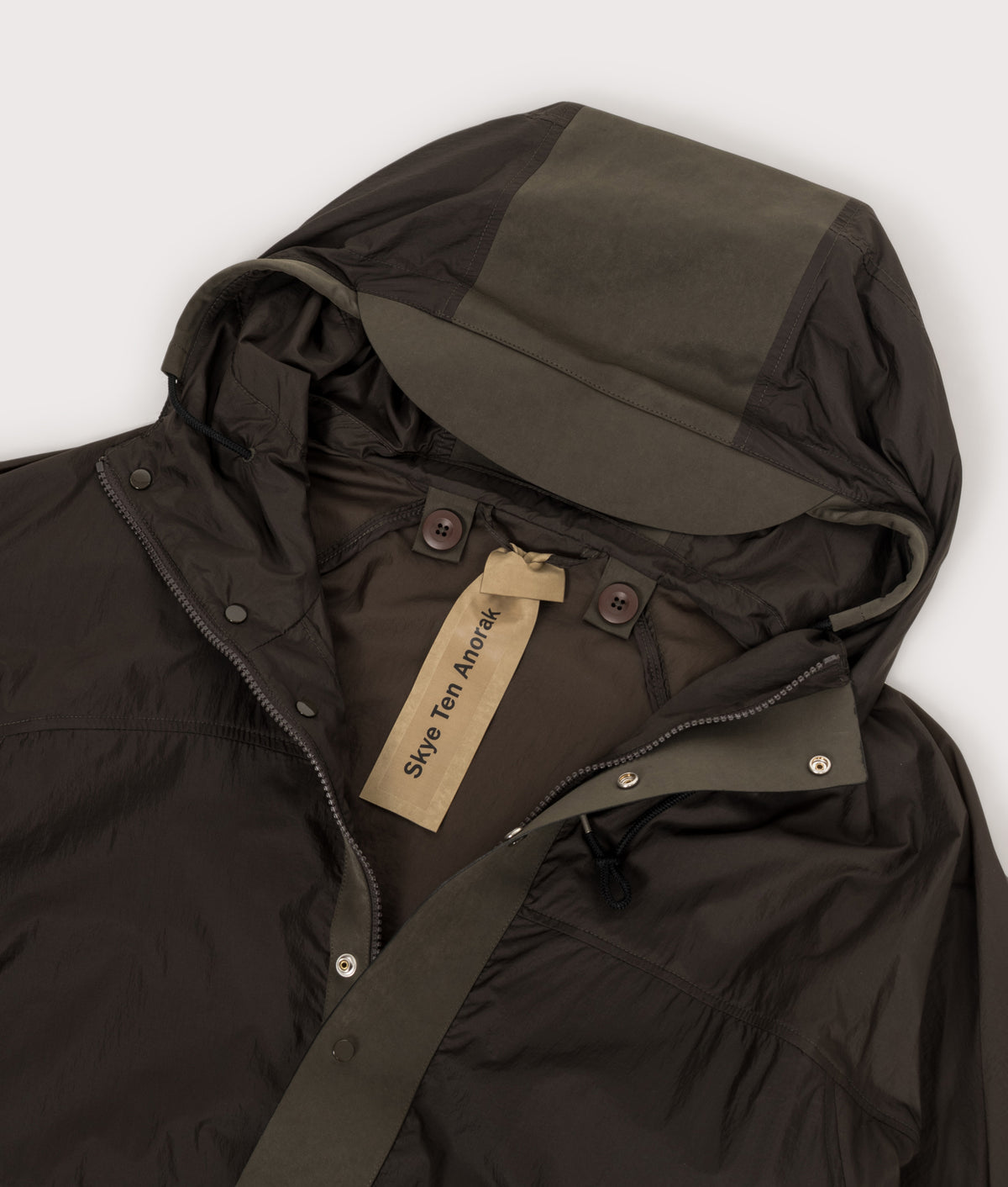 Ten c Skye Ten Anorak Jacket in Green Lizard at EQVVS Menswear. Hood detail shot.