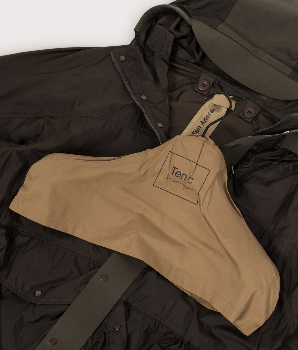Ten c Skye Ten Anorak Jacket in Green Lizard at EQVVS Menswear. Hanger shot.