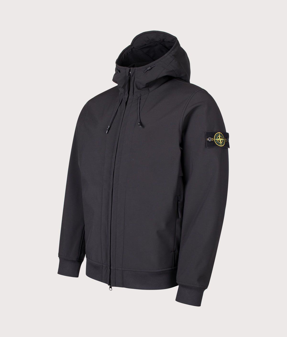 Stone Island Soft Shell-R_E DYE® Technology Jacket in Black at EQVVS Menswear. Angled front shot.