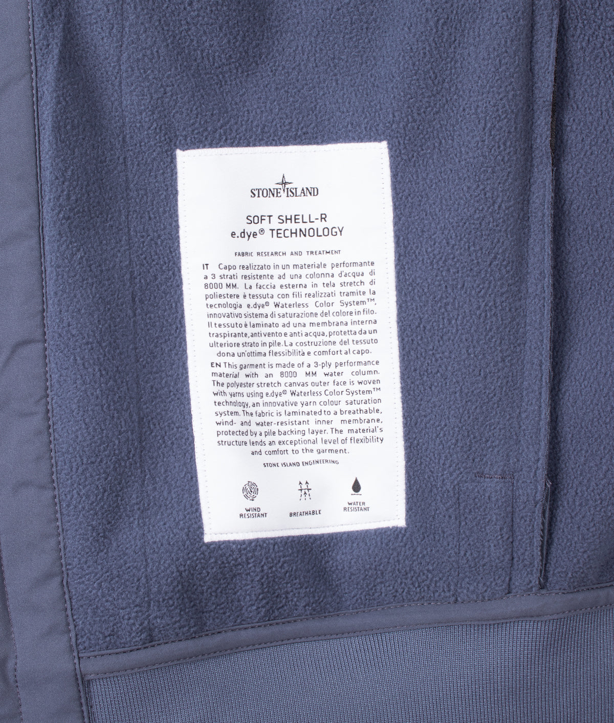 Stone Island Soft Shell-R_E.Dye® Technology Jacket in Slate Blue at EQVVS Menswear. Label shot.