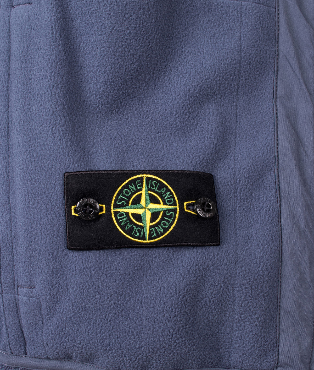 Stone Island Soft Shell-R_E.Dye® Technology Jacket in Slate Blue at EQVVS Menswear. Detail shot.
