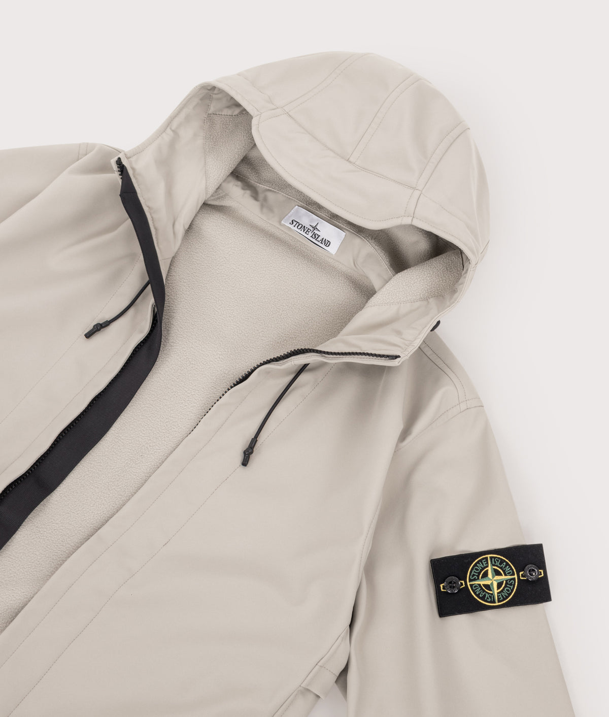 Stone Island Soft Shell-R_E.Dye® Technology Jacket in sand at EQVVS Menswear. Detail shot.