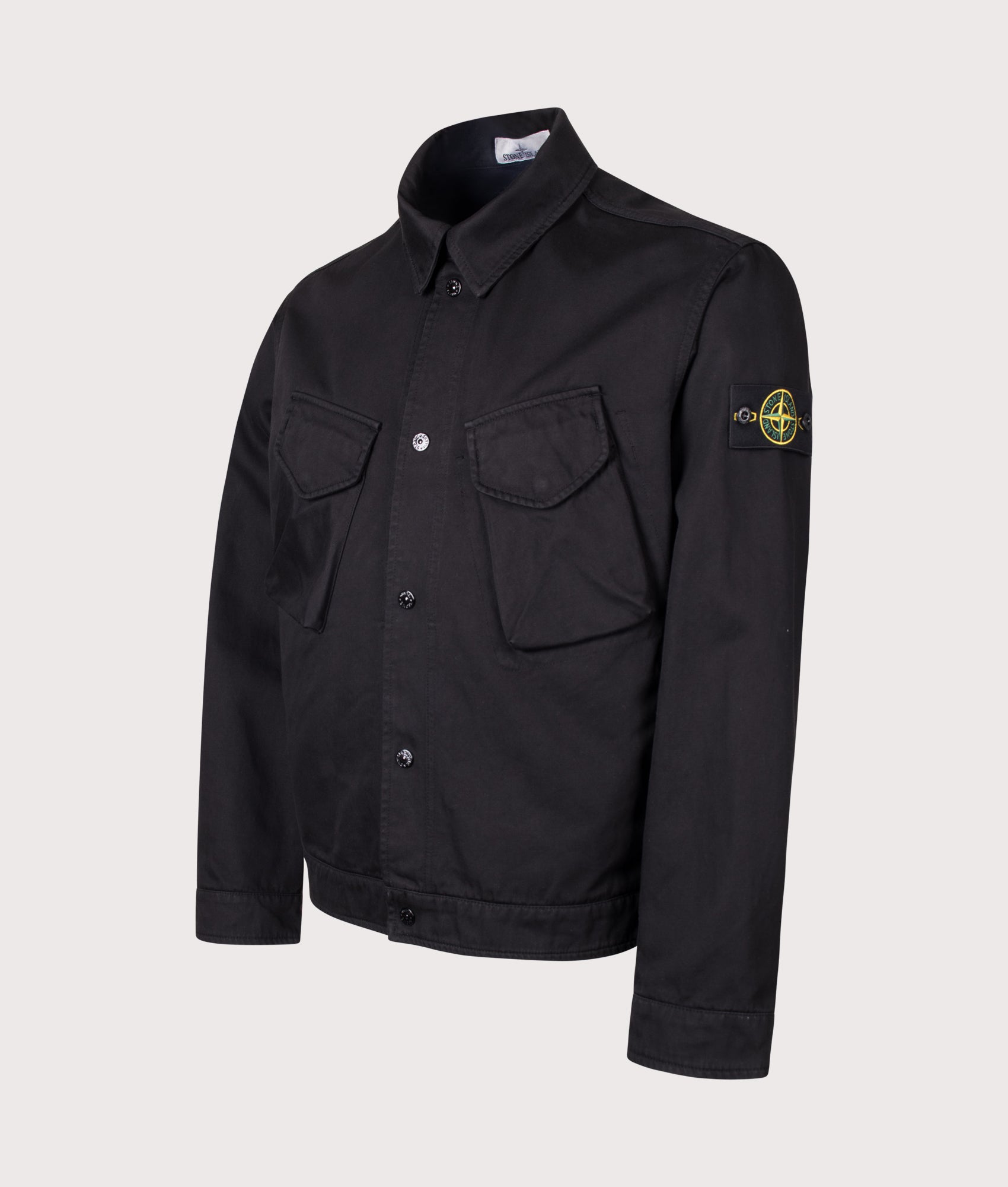 Stone Island Dense Cotton Twill-TC Jacket in Black at EQVVS Menswear. Angled front shot.