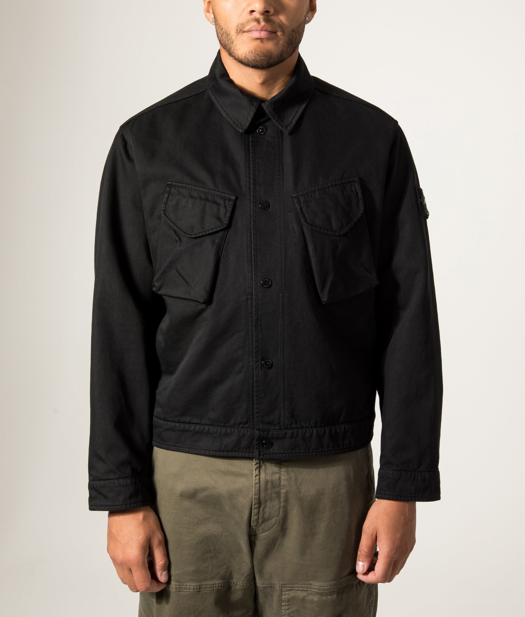 Stone Island Dense Cotton Twill-TC Jacket in Black at EQVVS Menswear. Model front shot.