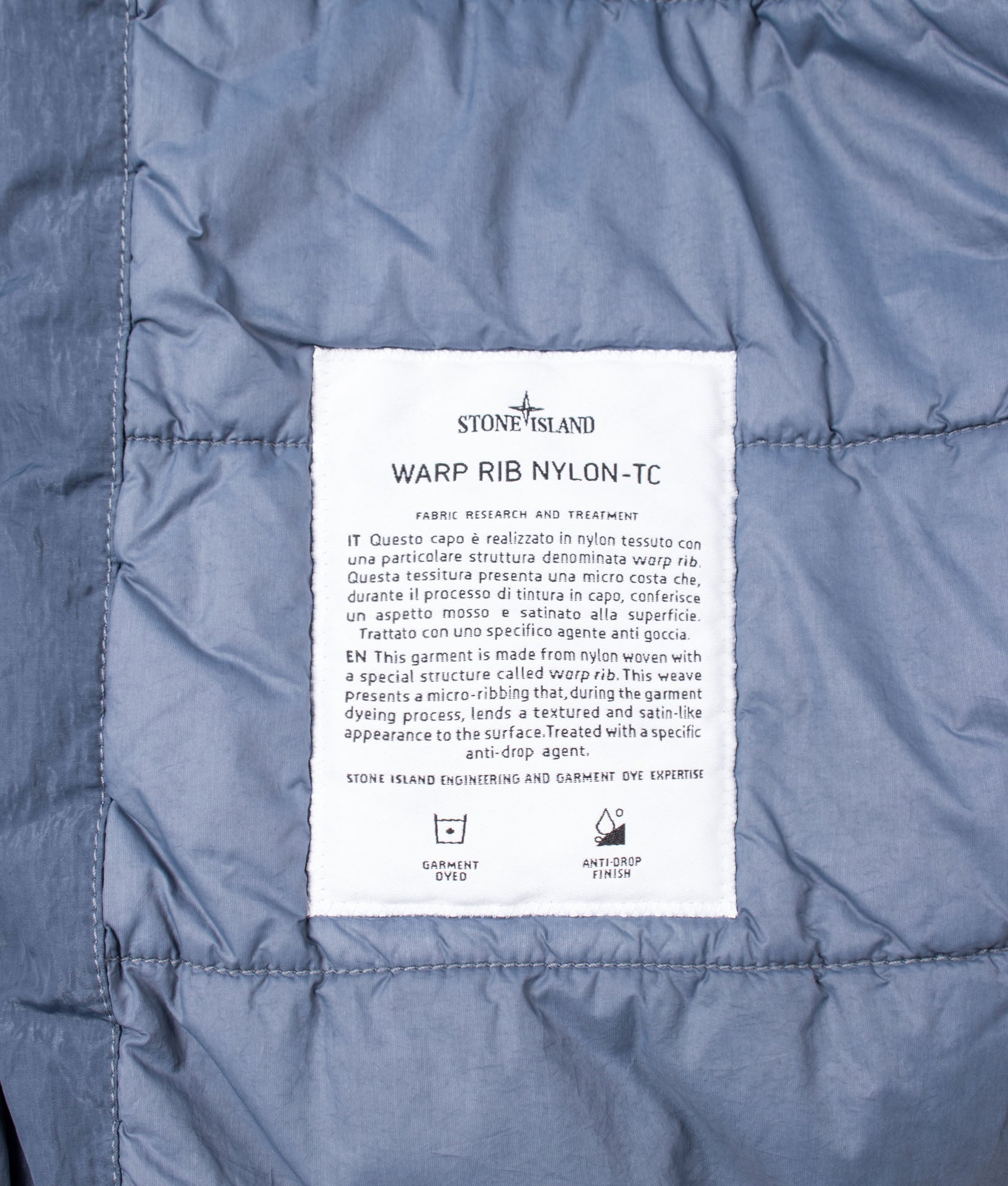 Stone Island Warp Rib Nylon-TC Jacket in Slate Blue at EQVVS Menswear. Internal label shot.