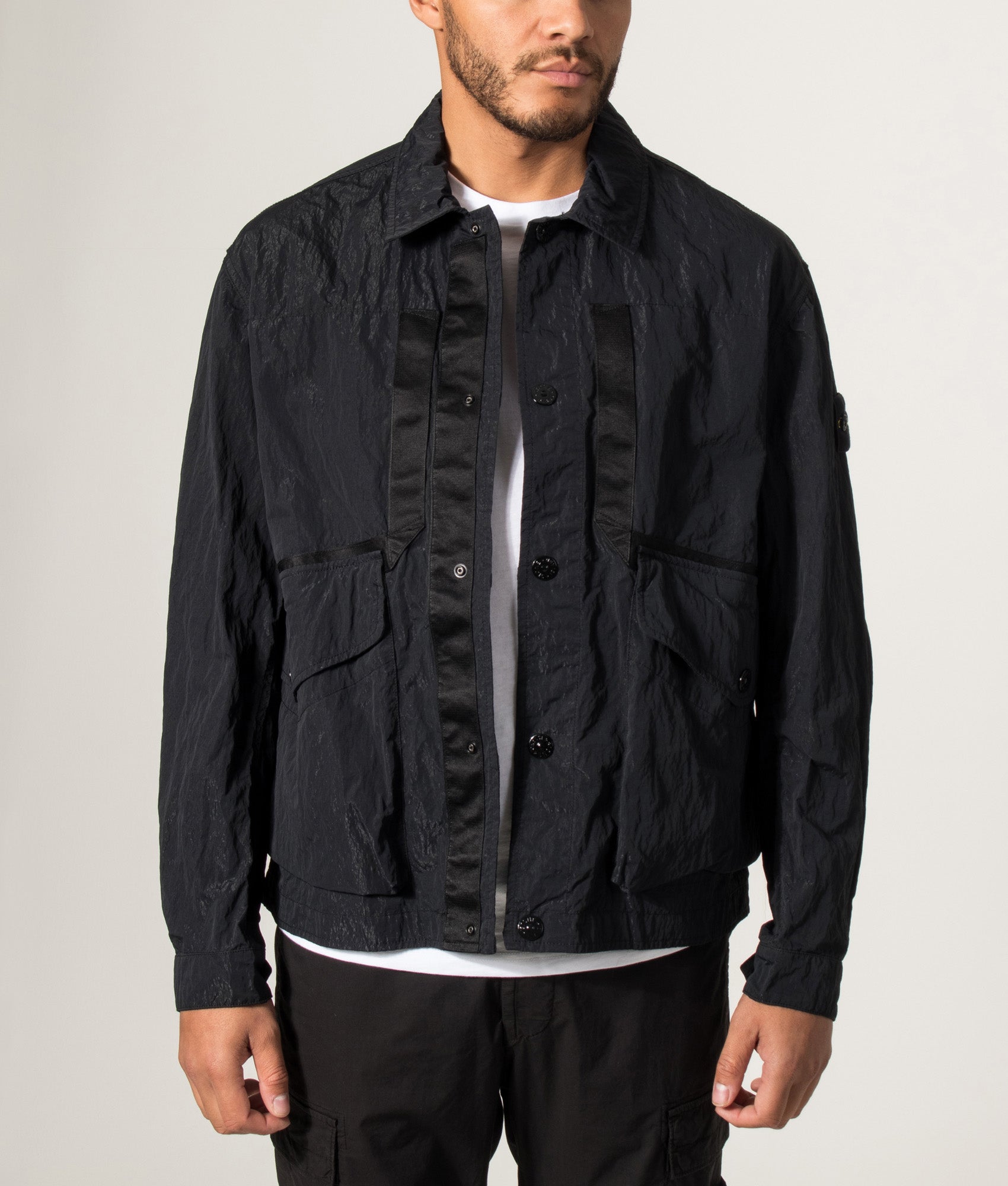 Stone Island Warp Rib Nylon-TC Jacket in Black at EQVVS Menswear. Model front shot.