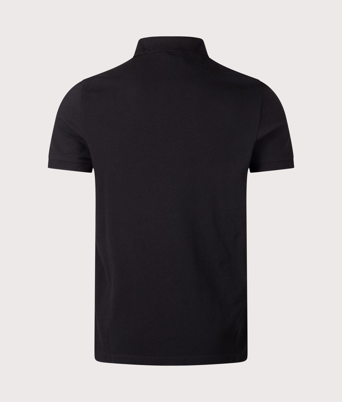 Stone Island Slim Fit Organic Cotton Piqué Polo Shirt in Black at EQVVS Menswear. Back shot.