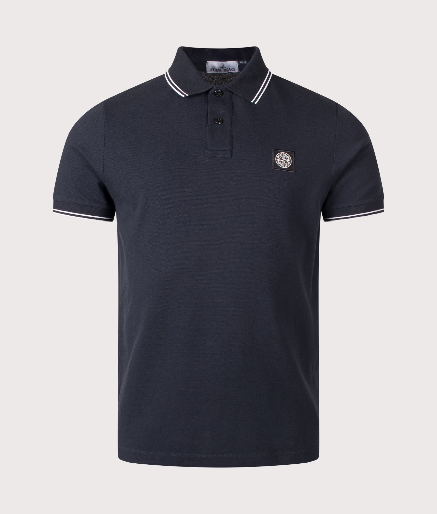 Stone Island Slim Fit Organic Cotton Polo Shirt in Navy Blue at EQVVS Menswear. Front shot.