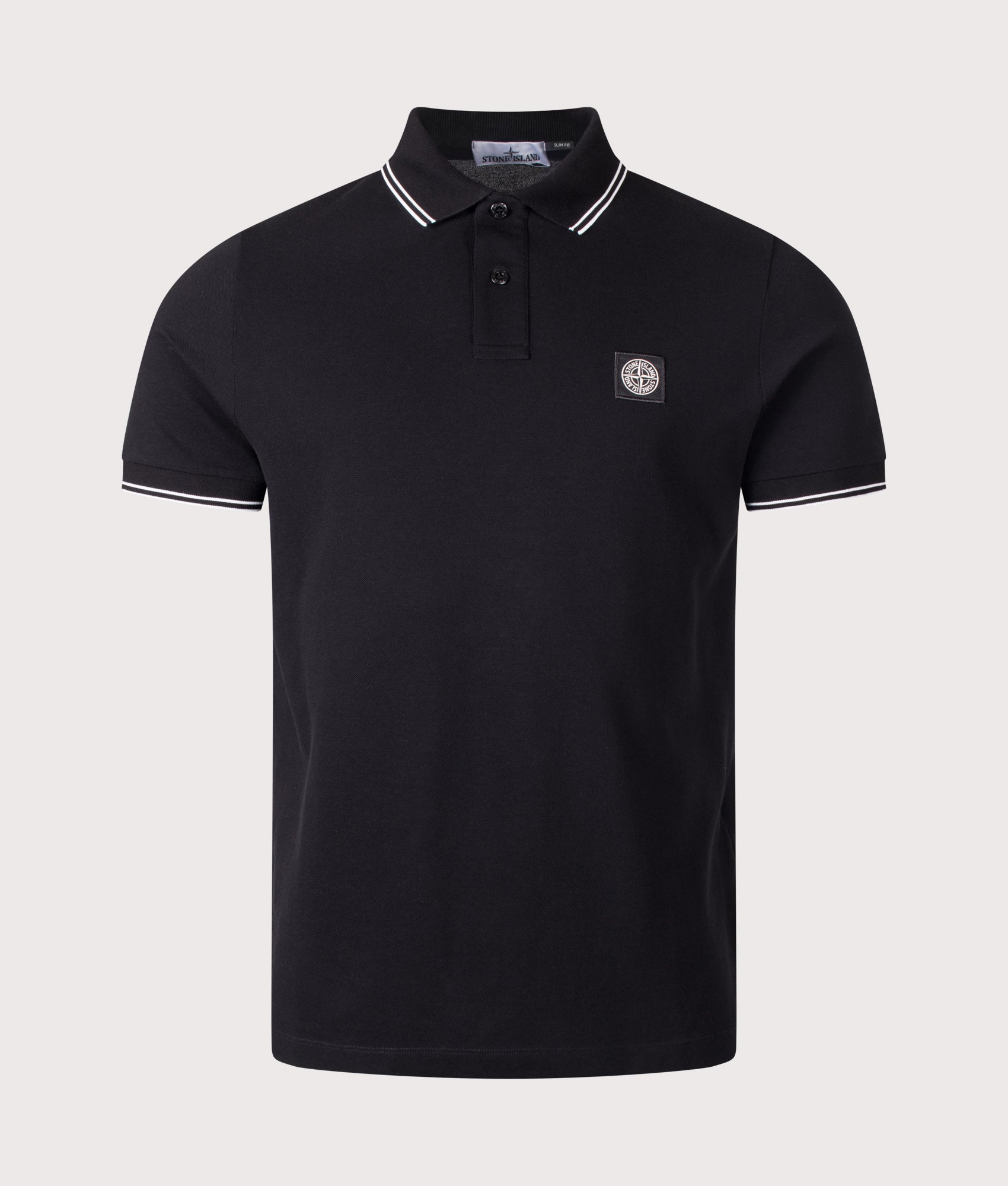 Stone Island Slim Fit Organic Cotton Polo Shirt in Black at EQVVS Menswear. Front shot.