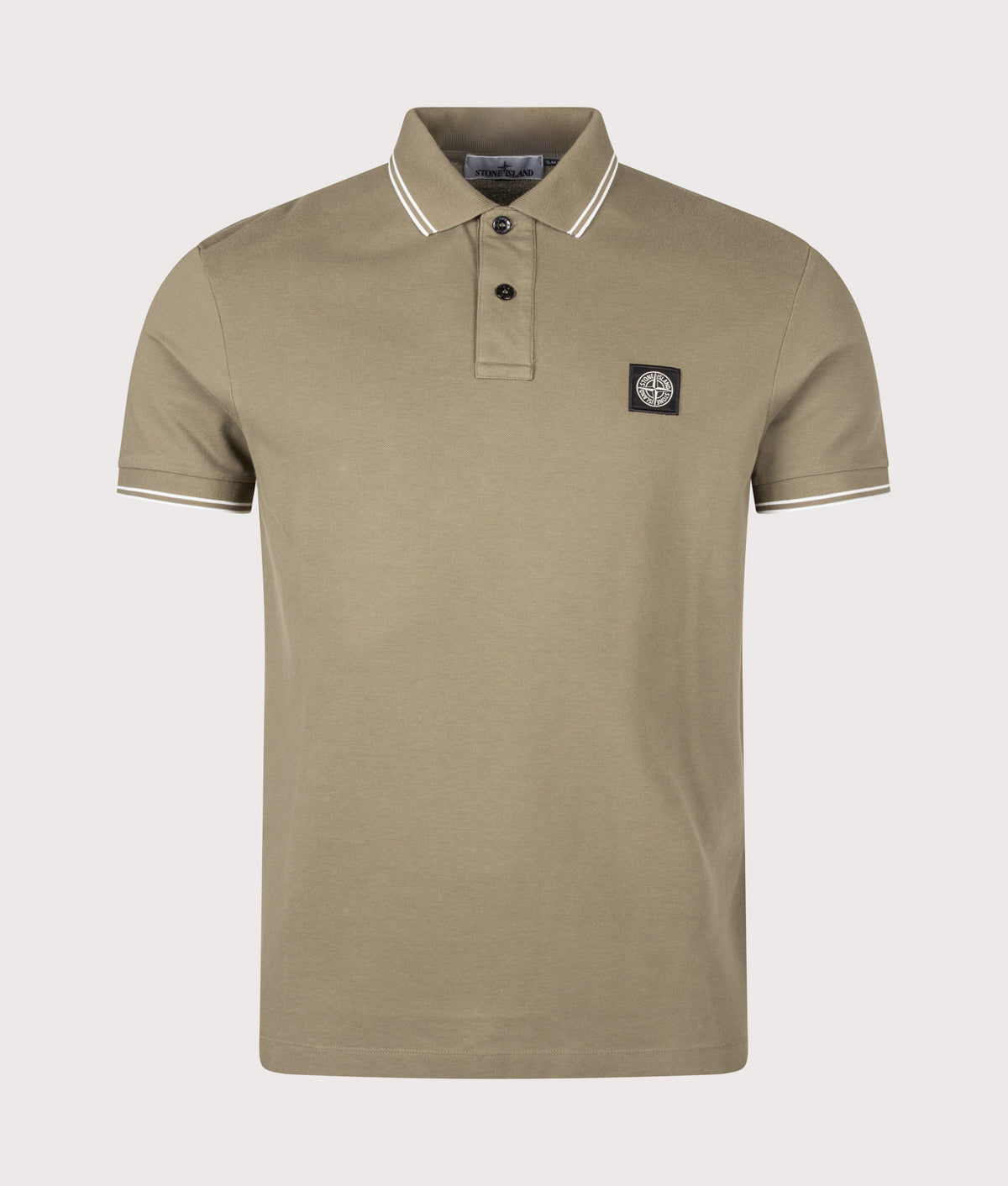 Stone Island staple Slim Fit Organic Cotton Polo Shirt in Military Green at EQVVS Menswear. Front shot.