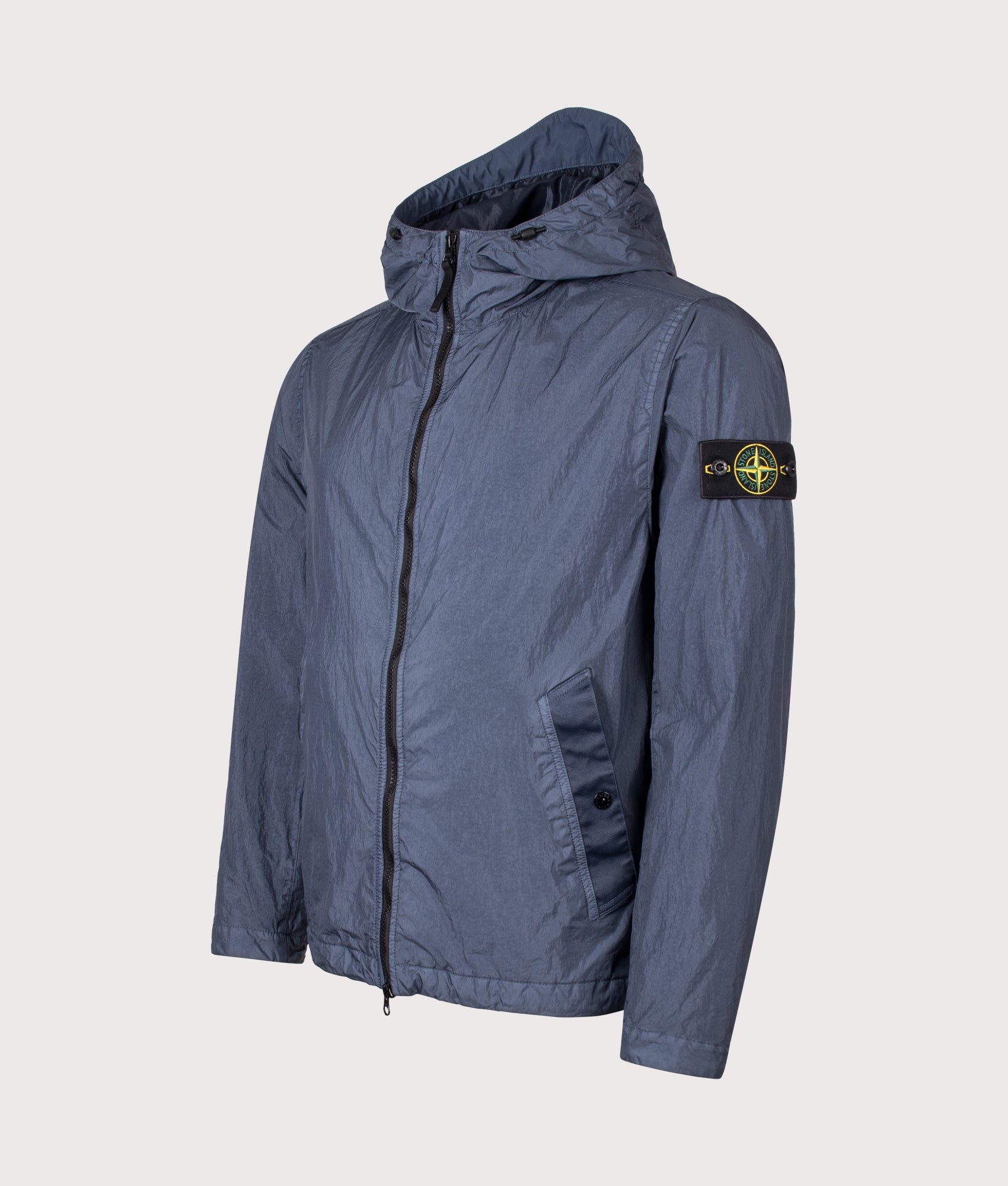 Stone Island Garment Dyed Crinkle Reps NY Jacket in Slate Blue at EQVVS Menswear. Angled front shot.