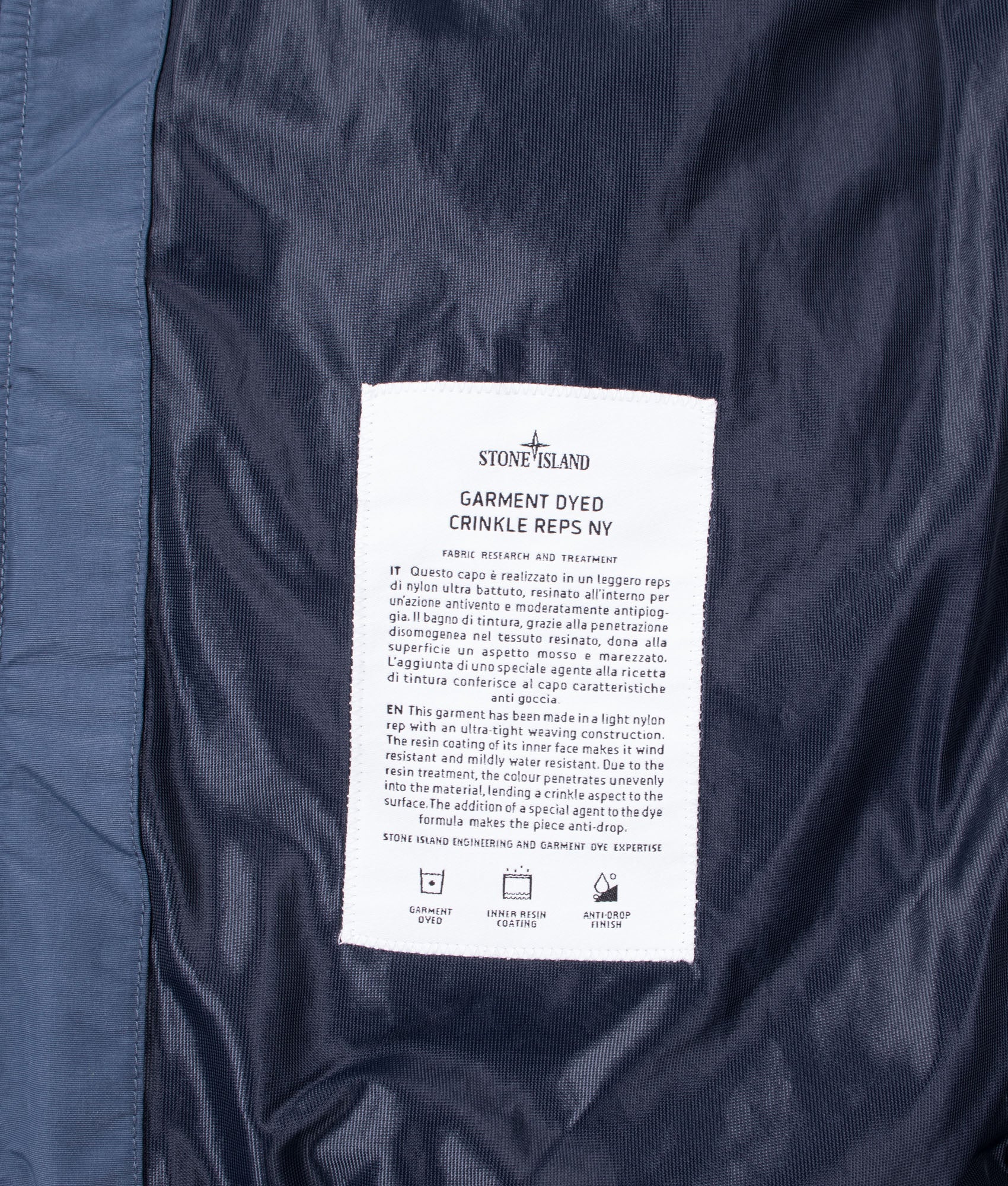 Stone Island Garment Dyed Crinkle Reps NY Jacket in Slate Blue at EQVVS Menswear. Internal label shot.