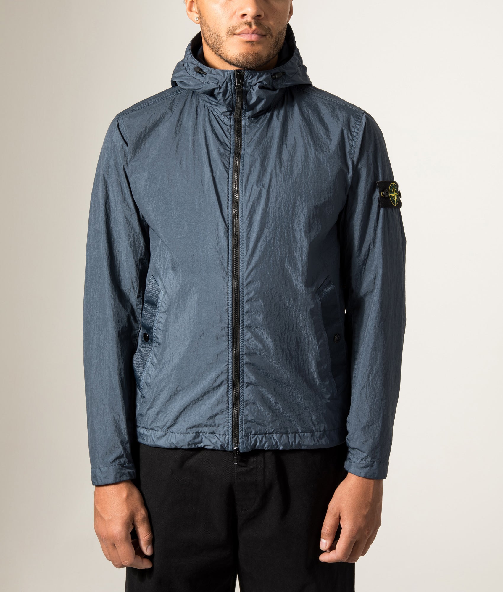 Stone Island Garment Dyed Crinkle Reps NY Jacket in Slate Blue at EQVVS Menswear. Model front shot.