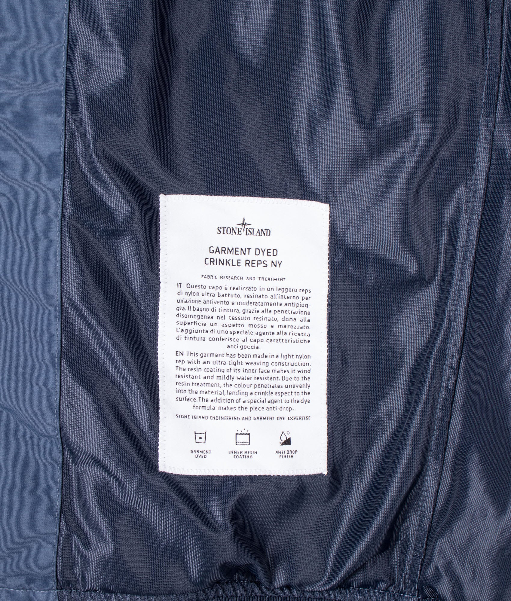 Stone Island Garment Dyed Crinkle Reps NY Jacket  in Slate Blue at EQVVS Menswear. Internal label shot.