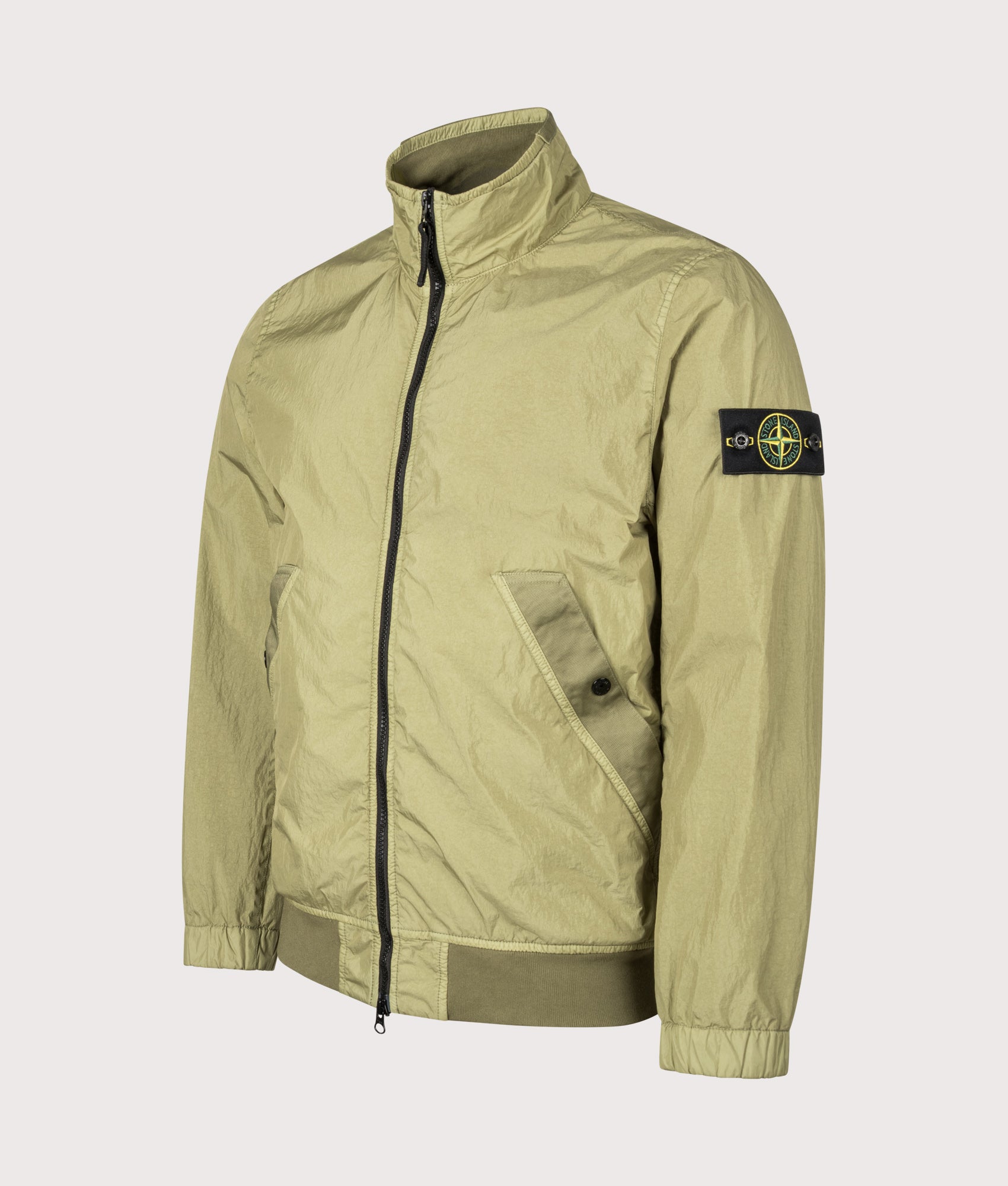 Stone Island Garment Dyed Crinkle Reps NY Jacket in Laurel Green at EQVVS Menswear. Angled front shot.