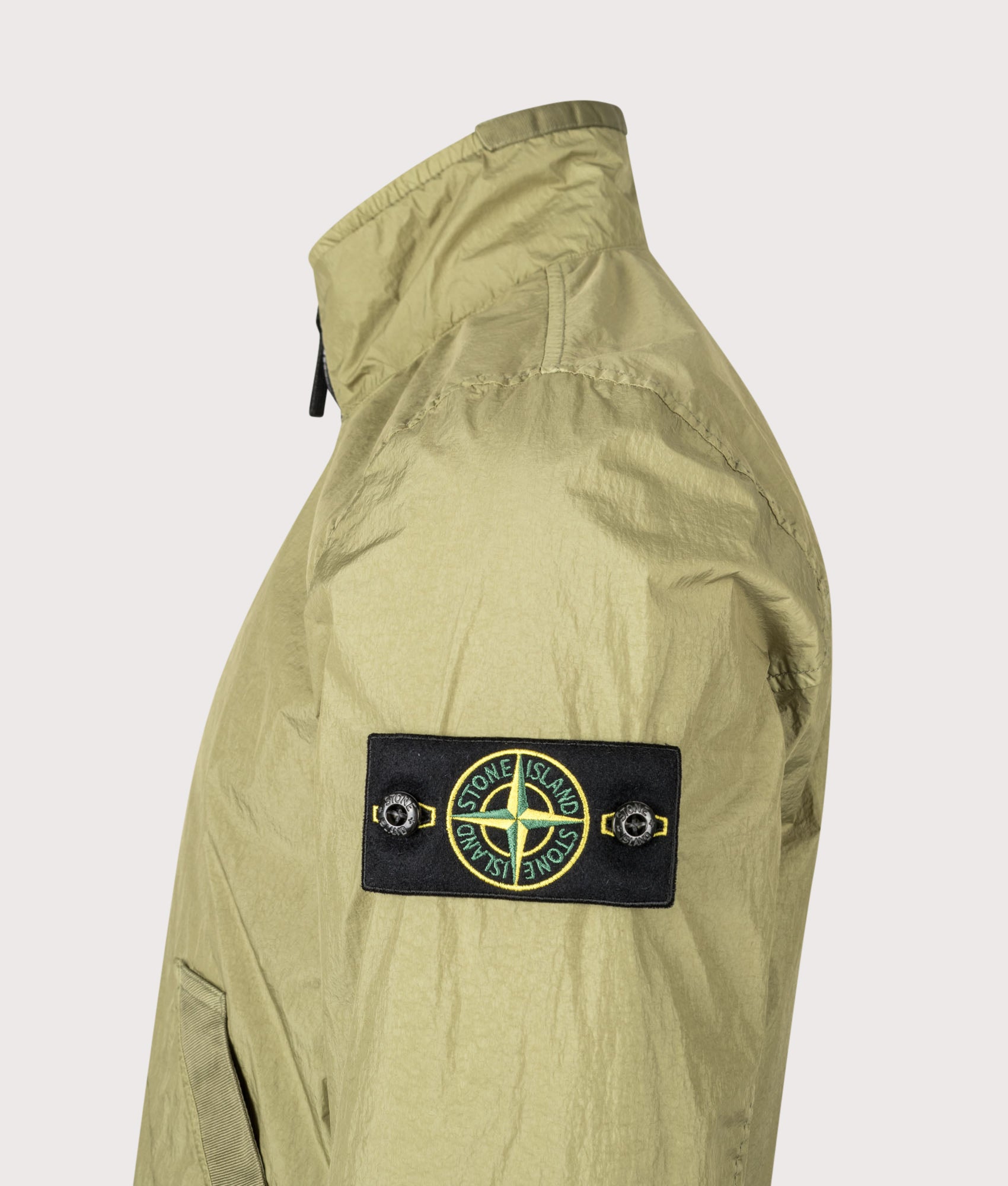 Stone Island Garment Dyed Crinkle Reps NY Jacket in Laurel Green at EQVVS Menswear. Detail shot.