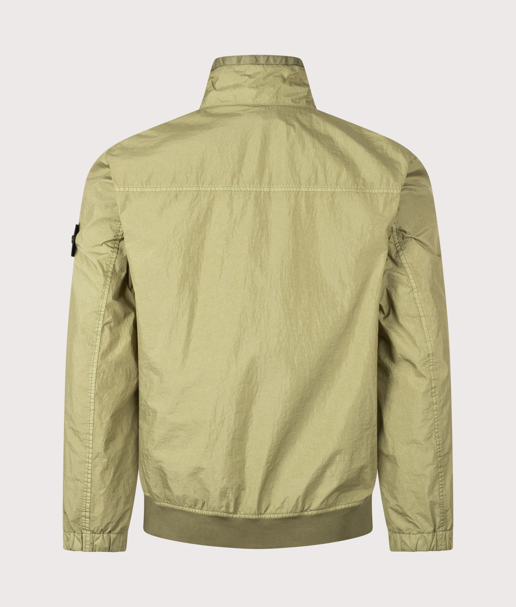 Stone Island Garment Dyed Crinkle Reps NY Jacket in Laurel Green at EQVVS Menswear. Back shot.