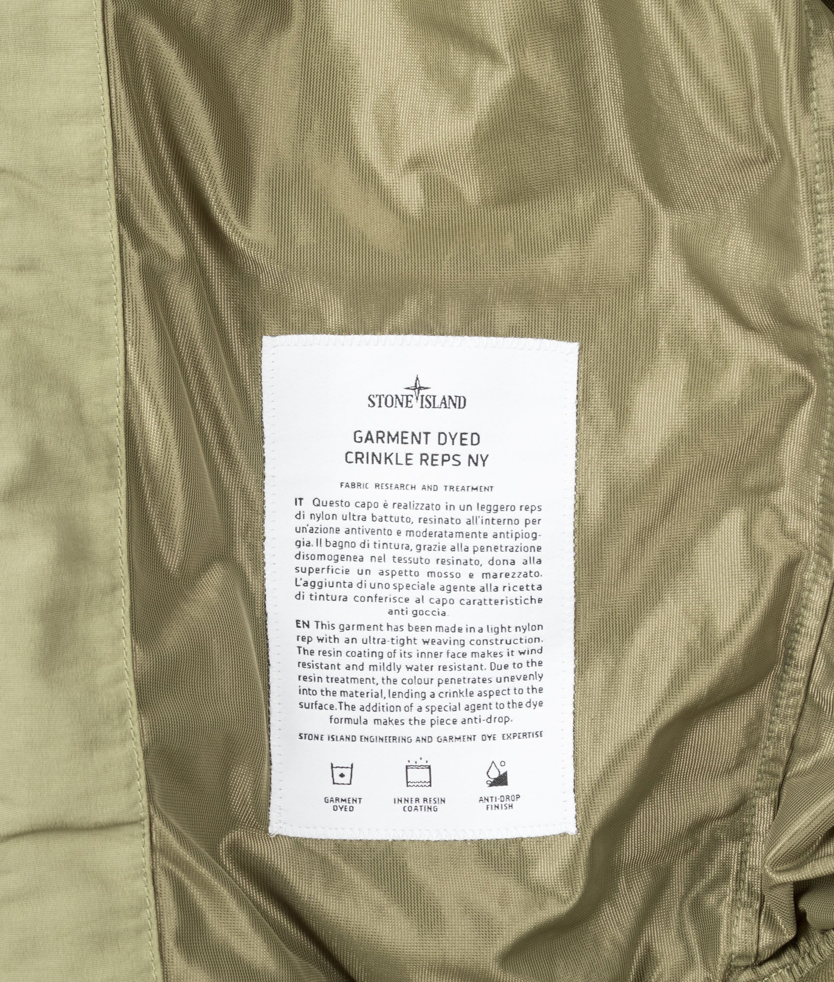 Stone Island Garment Dyed Crinkle Reps NY Jacket in Laurel Green at EQVVS Menswear. Internal label shot.