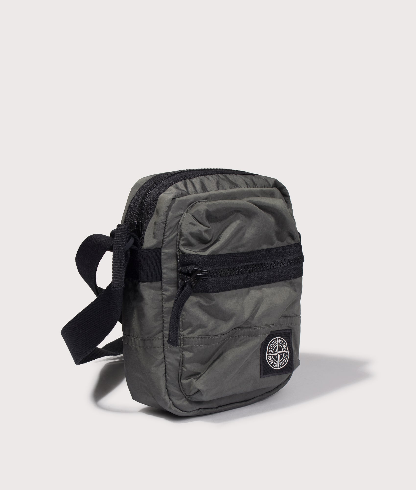 Stone Island Coated Nylon Metal in Econyl® Crossbody Bag in Musk at EQVVS Menswear. Angled front shot.