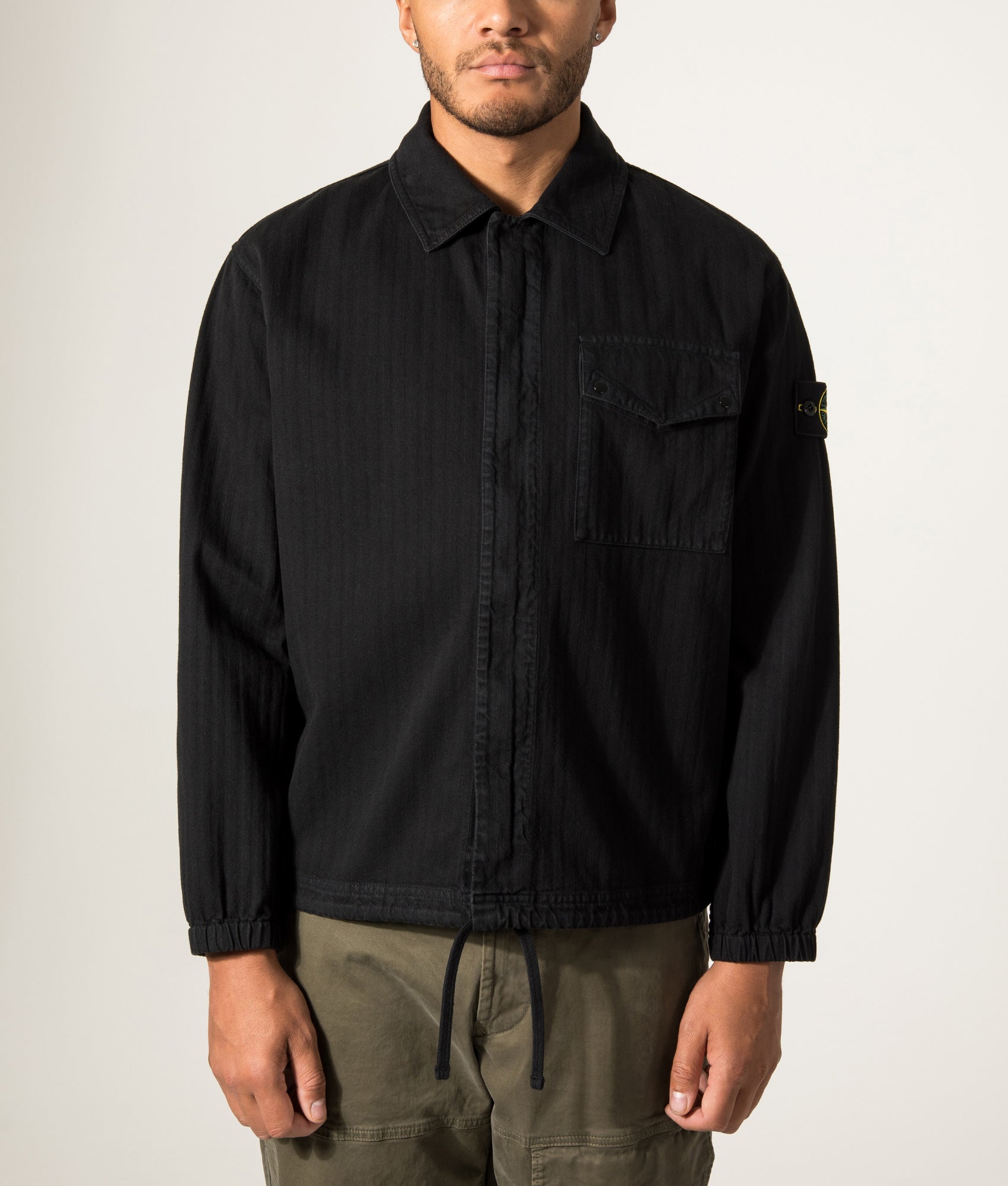 Stone Island Organic Cotton Twill Overshirt in Black at EQVVS Menswear. Model front shot.