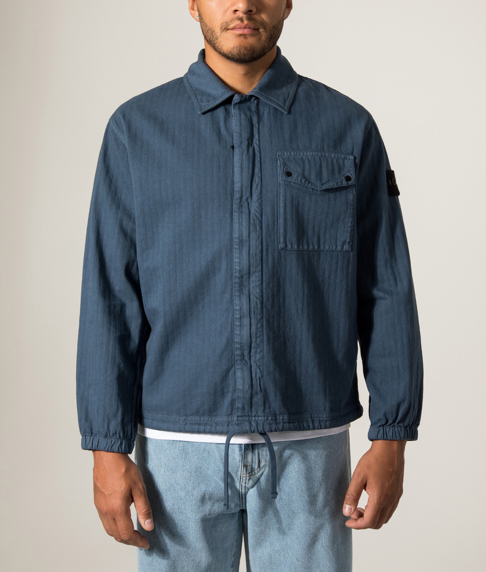 Stone Island Organic Cotton Twill Overshirt in Slate Blue at EQVVS Menswear. Model front shot.