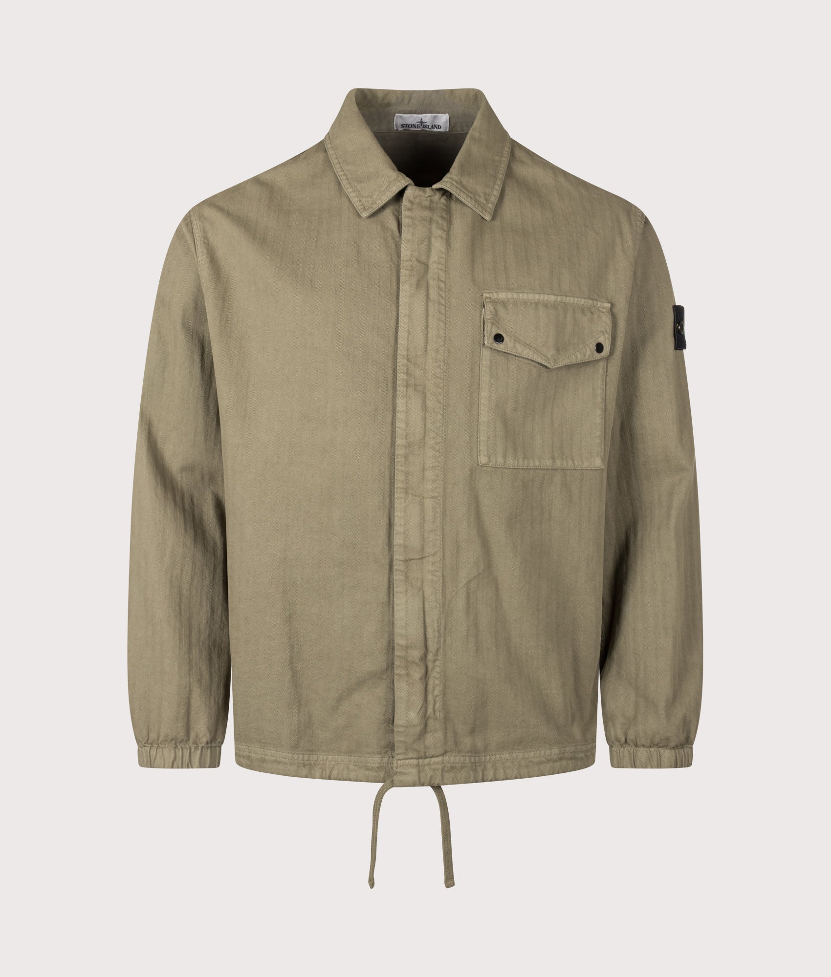 Stone Island Cotton Herringbone Overshirt in Military Green at EQVVS Menswear. Front shot.