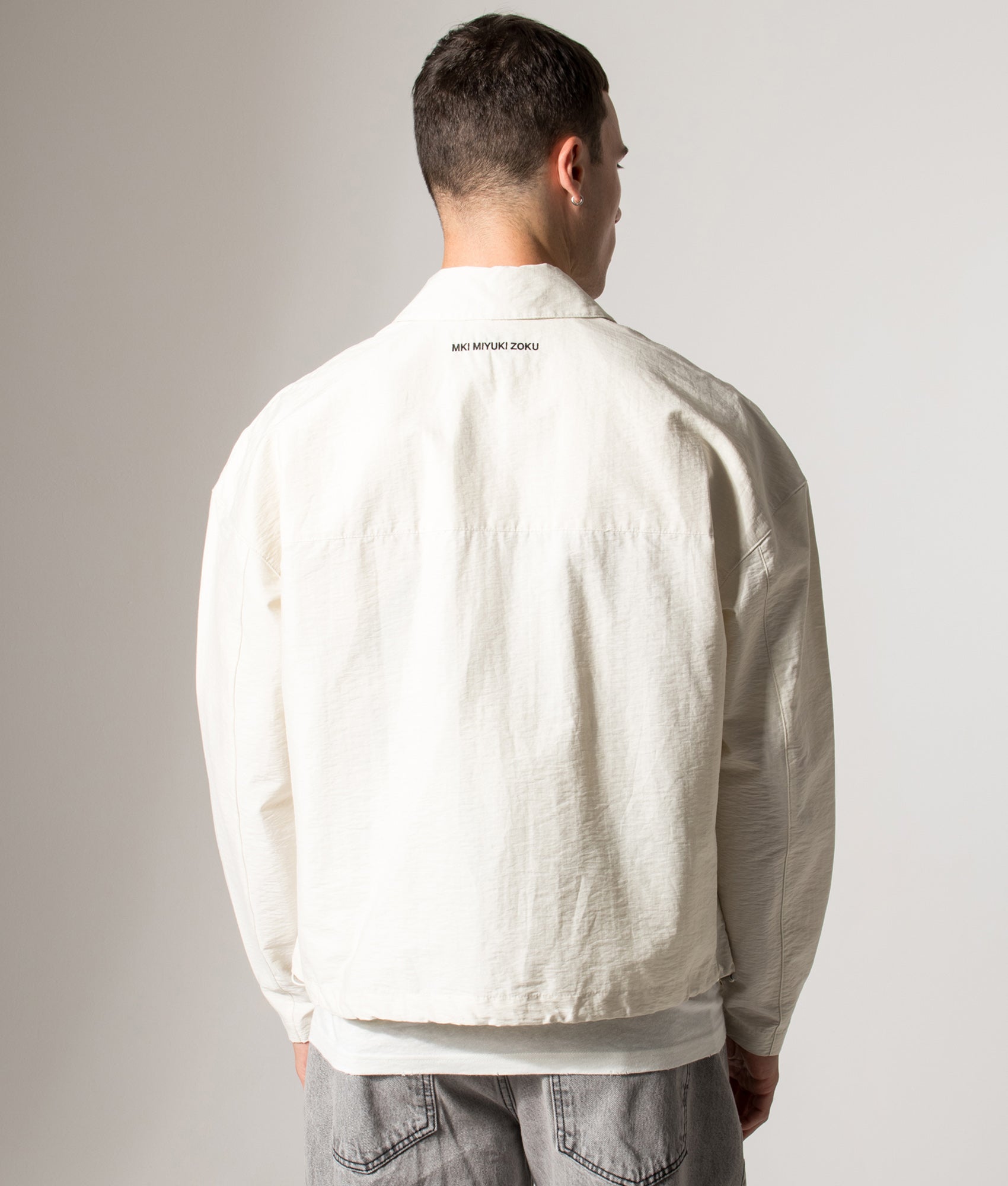 Box Overshirt. Shot by EQVVS. Model back angled shot.