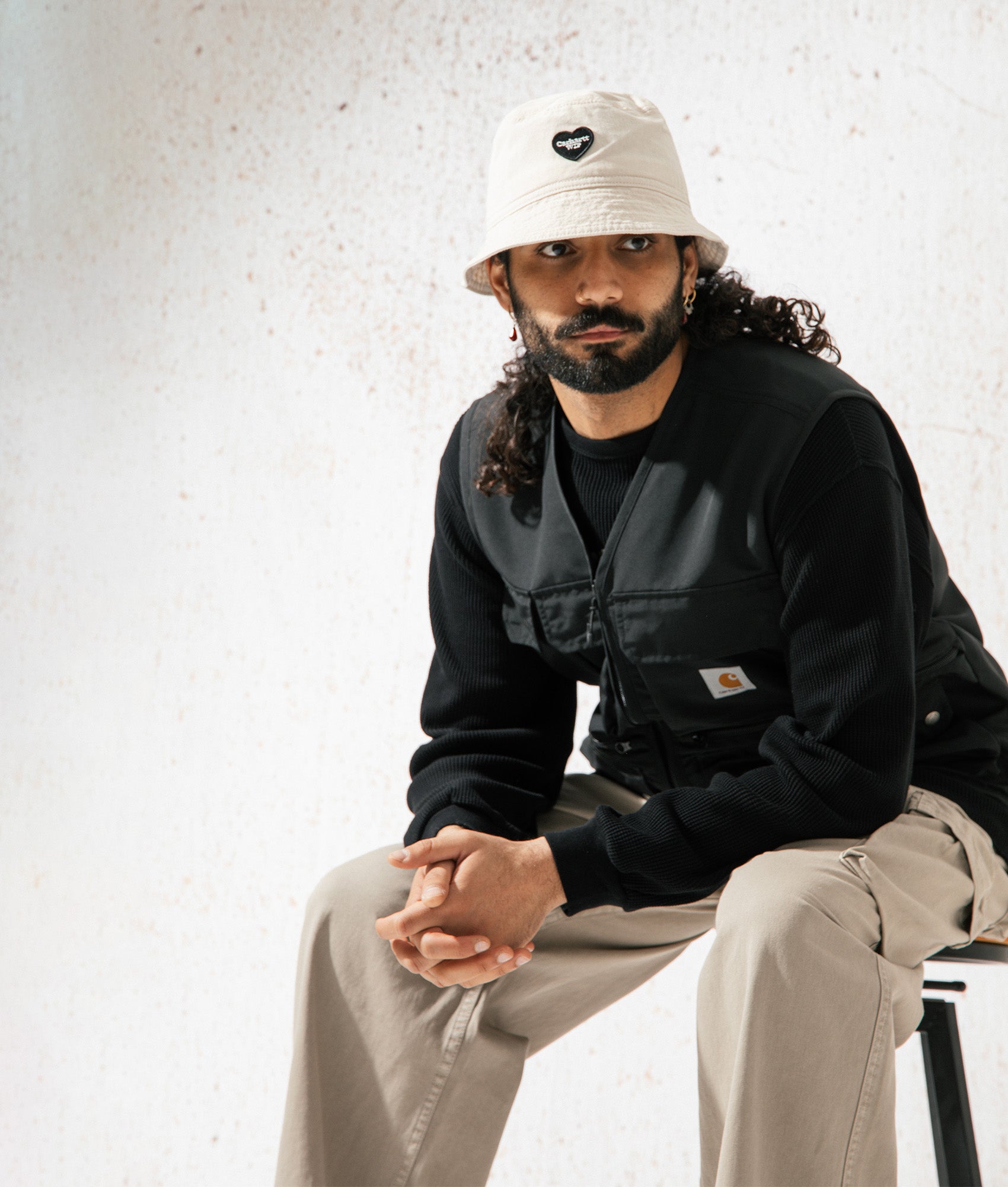 Carhartt WIP Irwin Vest in Black at EQVVS. Campaign shot. 