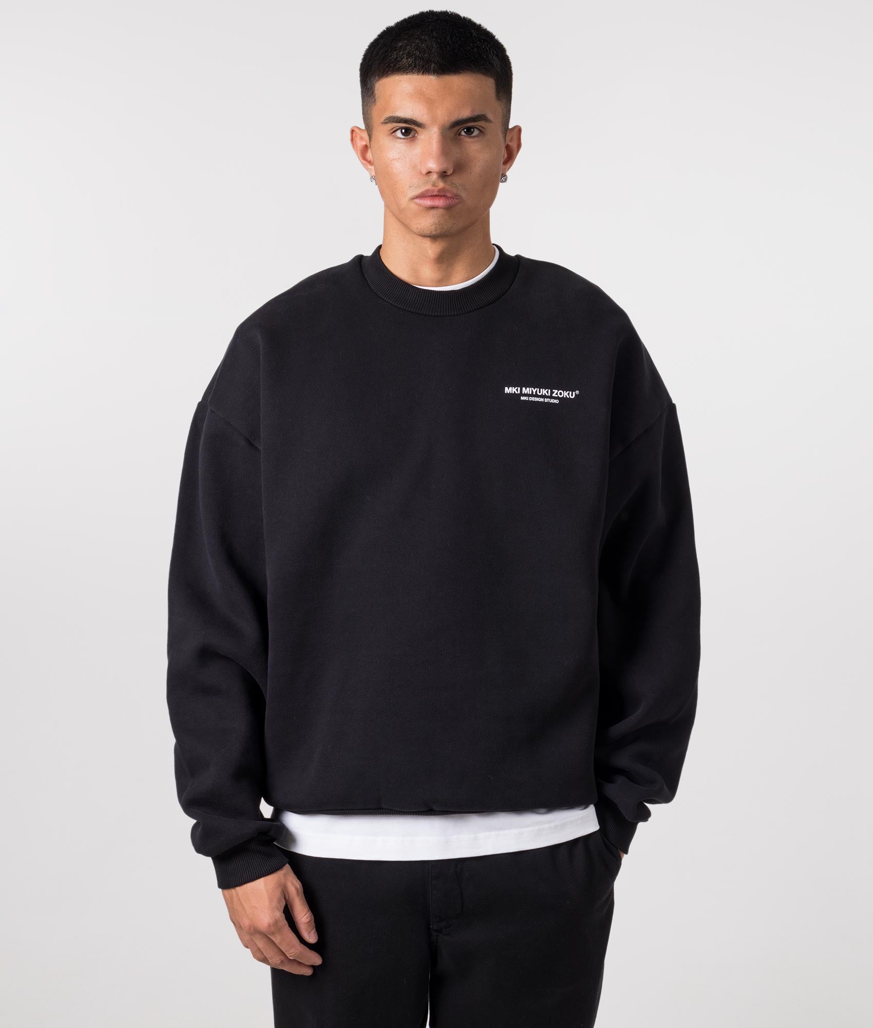 MKI MIYUKI ZOKU Oversized studio sweatshirt in Black at EQVVS Menswear.  Model front shot.