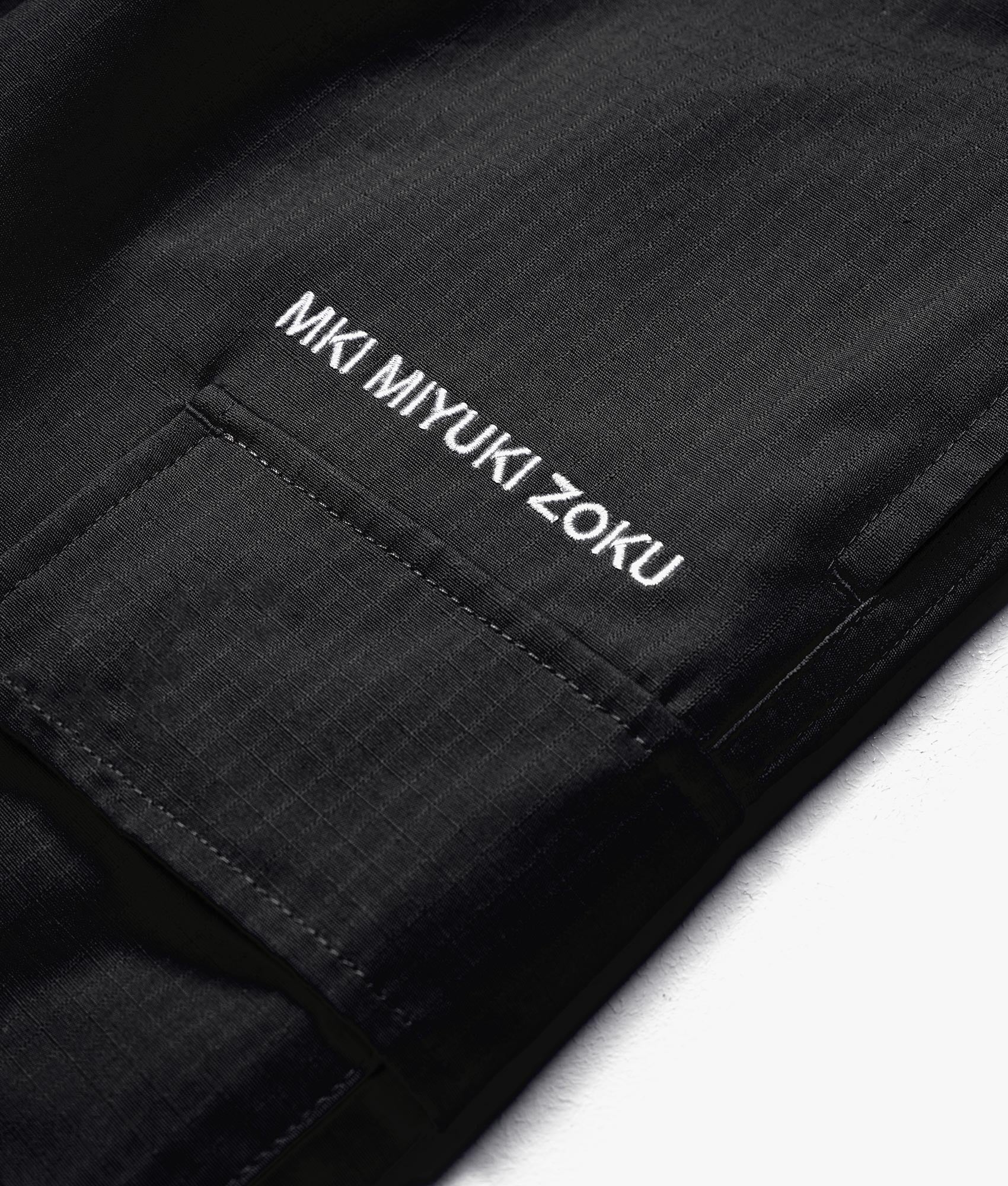 Relaxed Fit Ripstop Cargo Shorts by MKI MIYUI ZOKU. EQVVS Detail Shot.