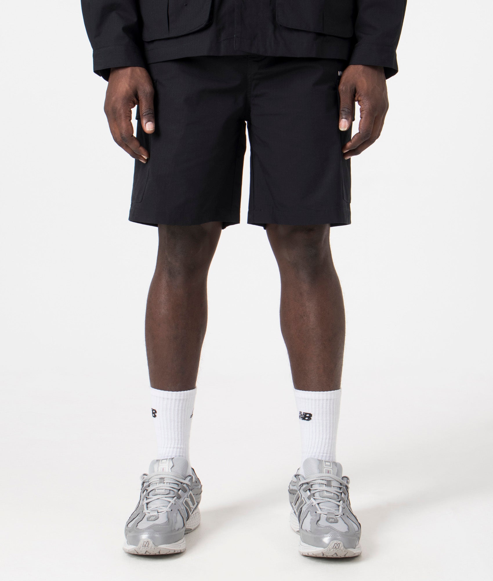 MKI Relaxed Fit Ripstop Cargo Shorts. Front angle model shot at EQVVS.