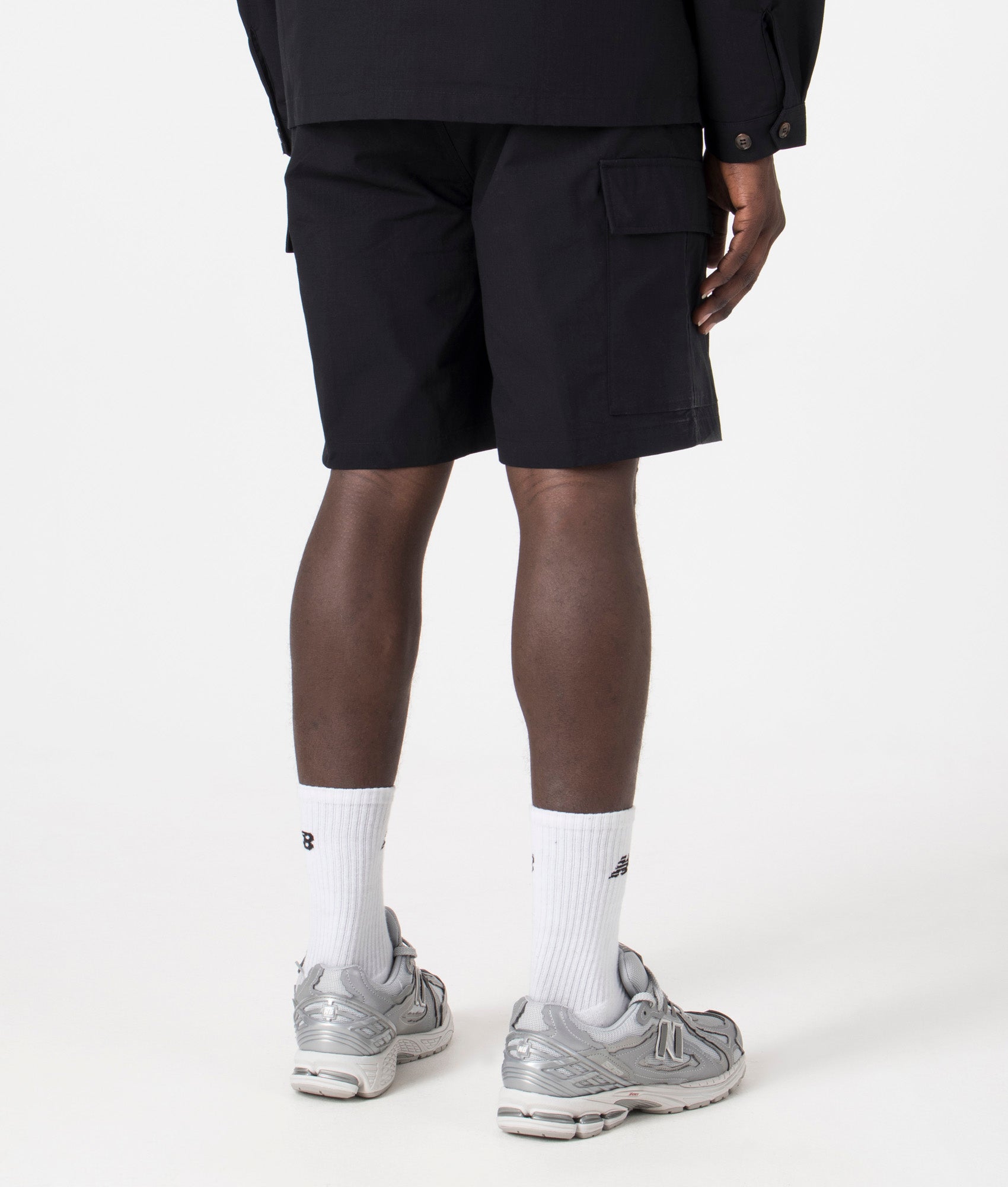 MKI Relaxed Fit Ripstop Cargo Shorts. Back angle model shot at EQVVS.
