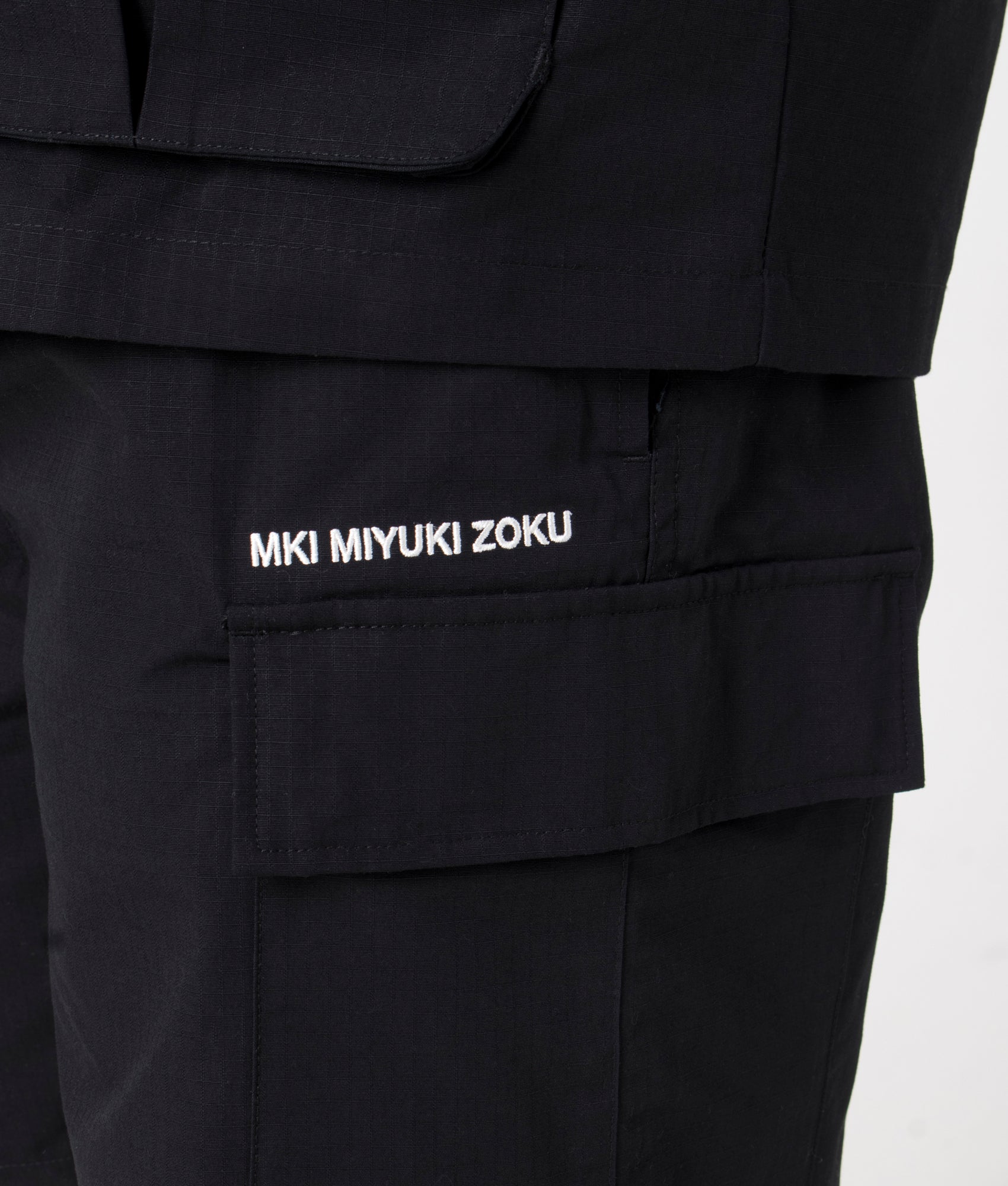 MKI Relaxed Fit Ripstop Cargo Shorts. Detail angle model shot at EQVVS.