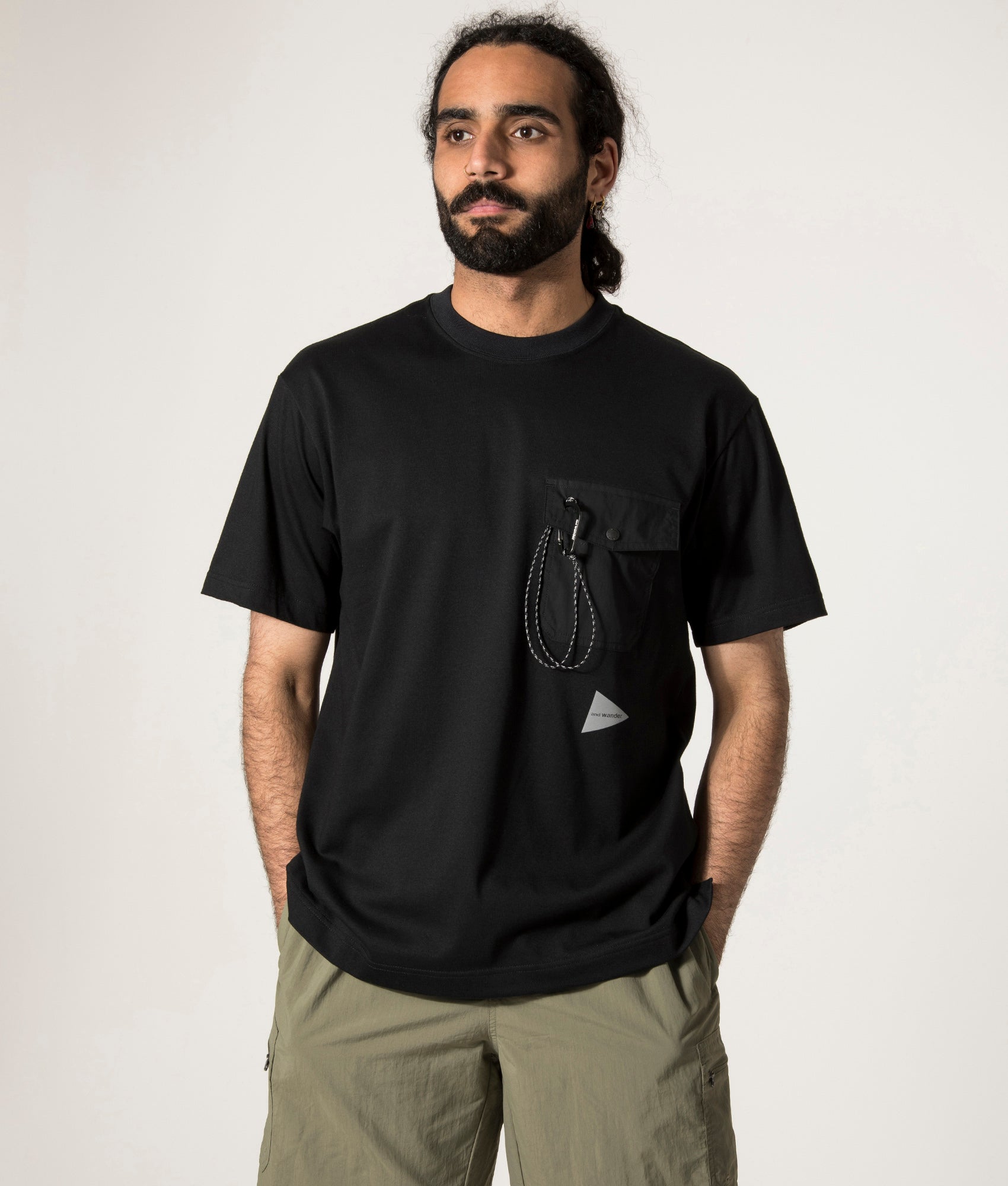 and wander Pocket T-Shirt in Black. Shot at EQVVS. Front Model Shot.