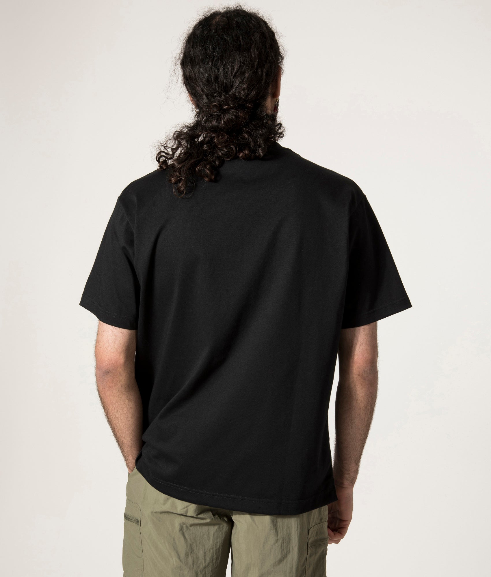 and wander Pocket T-Shirt in Black. Shot at EQVVS. Back Detail Shot.
