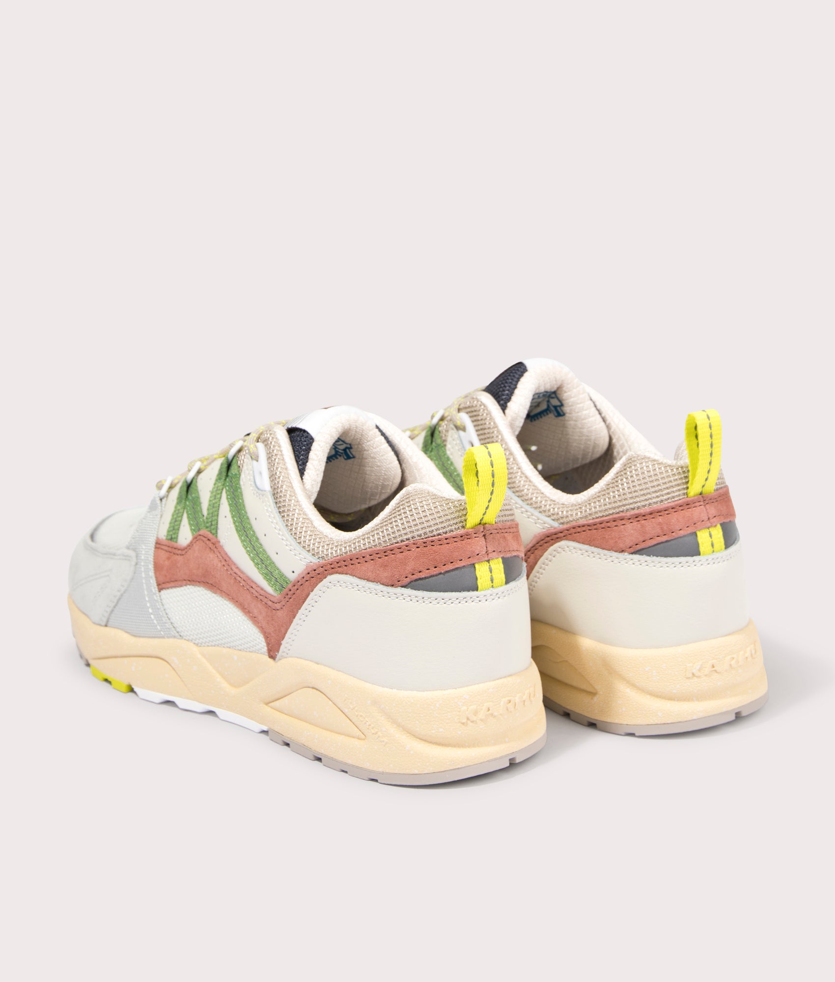 Fusion 2.0 Sneakers in Lily White/ Piquante Green by Karhu. EQVVS Back Pair Shot.