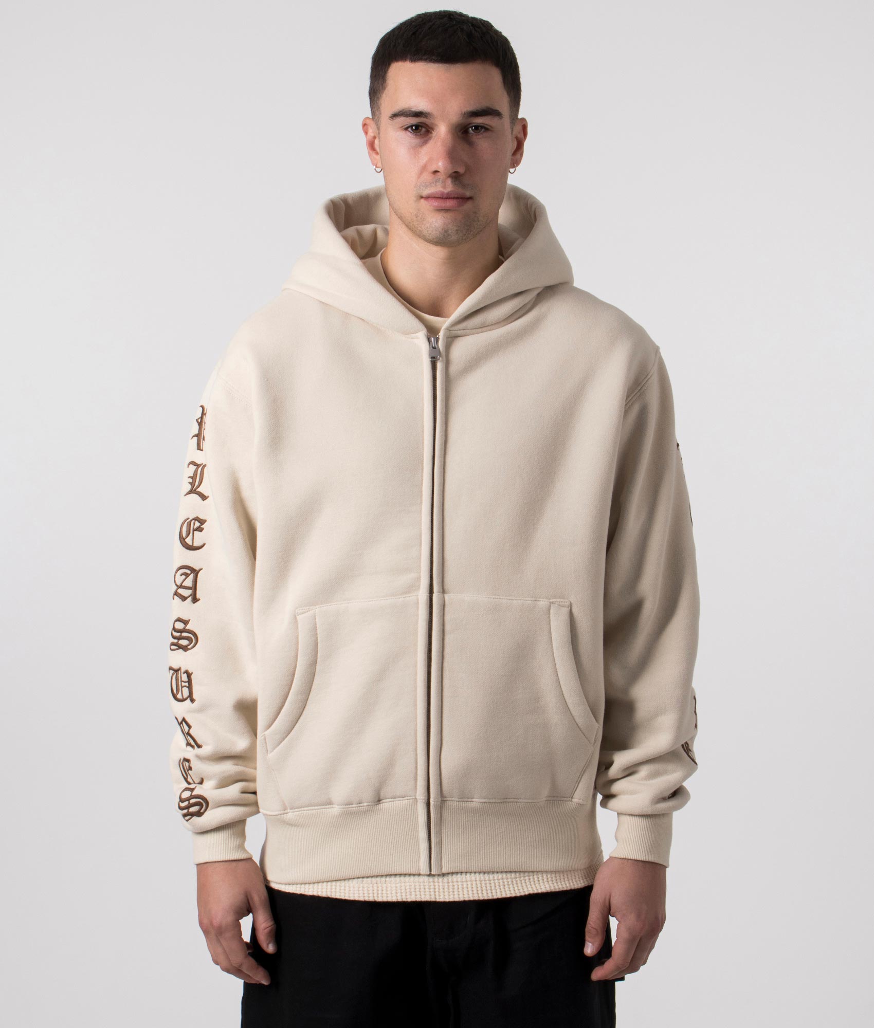 Old English Zip Up Hoodie in Natural by Pleasures. EQVVS Menswear Front Model Shot. 