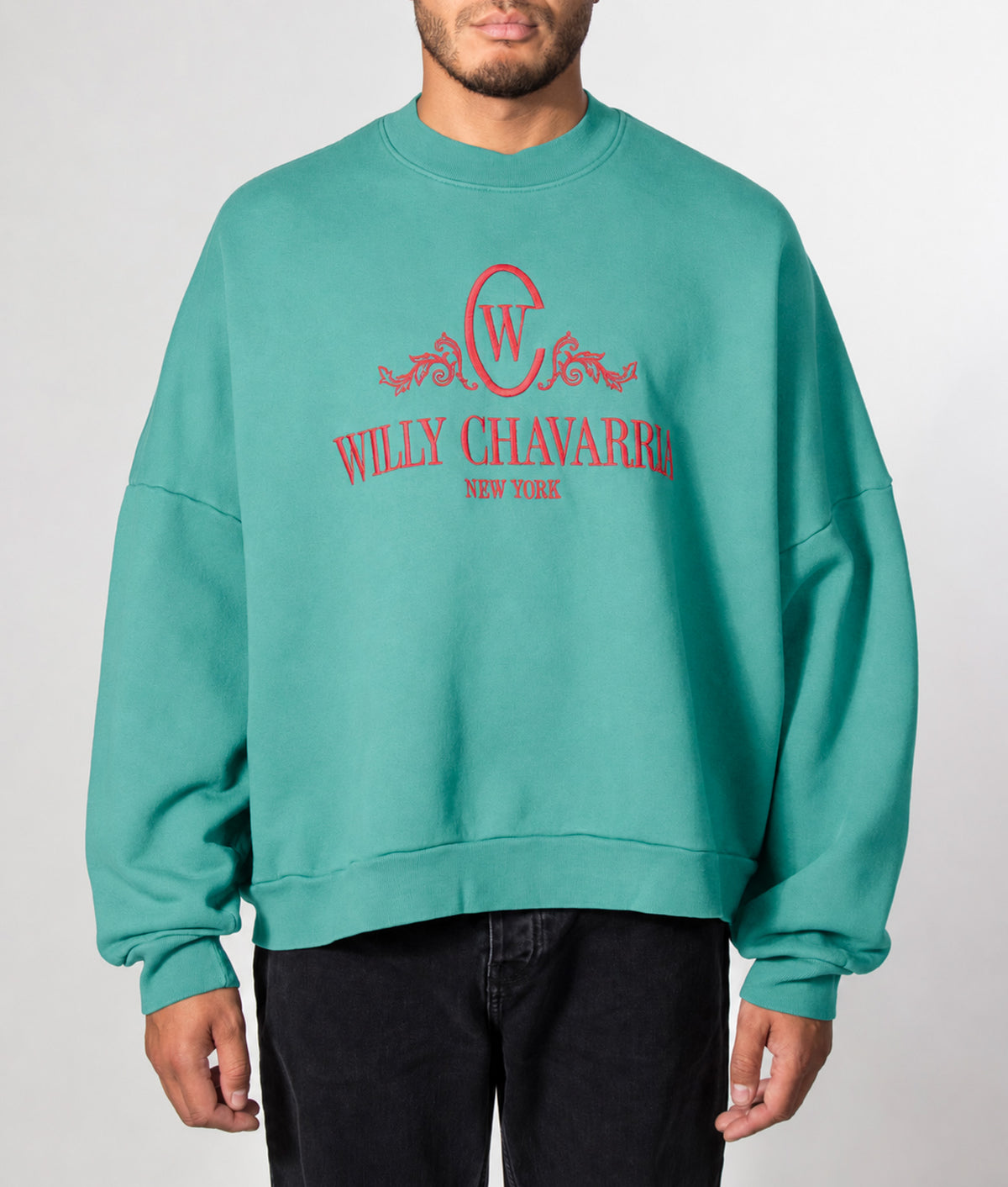 Willy Chavarria Super Oversized Chavantino Hooligan Sweatshirt in Prouve Green at EQVVS Menswear. Model front shot.
