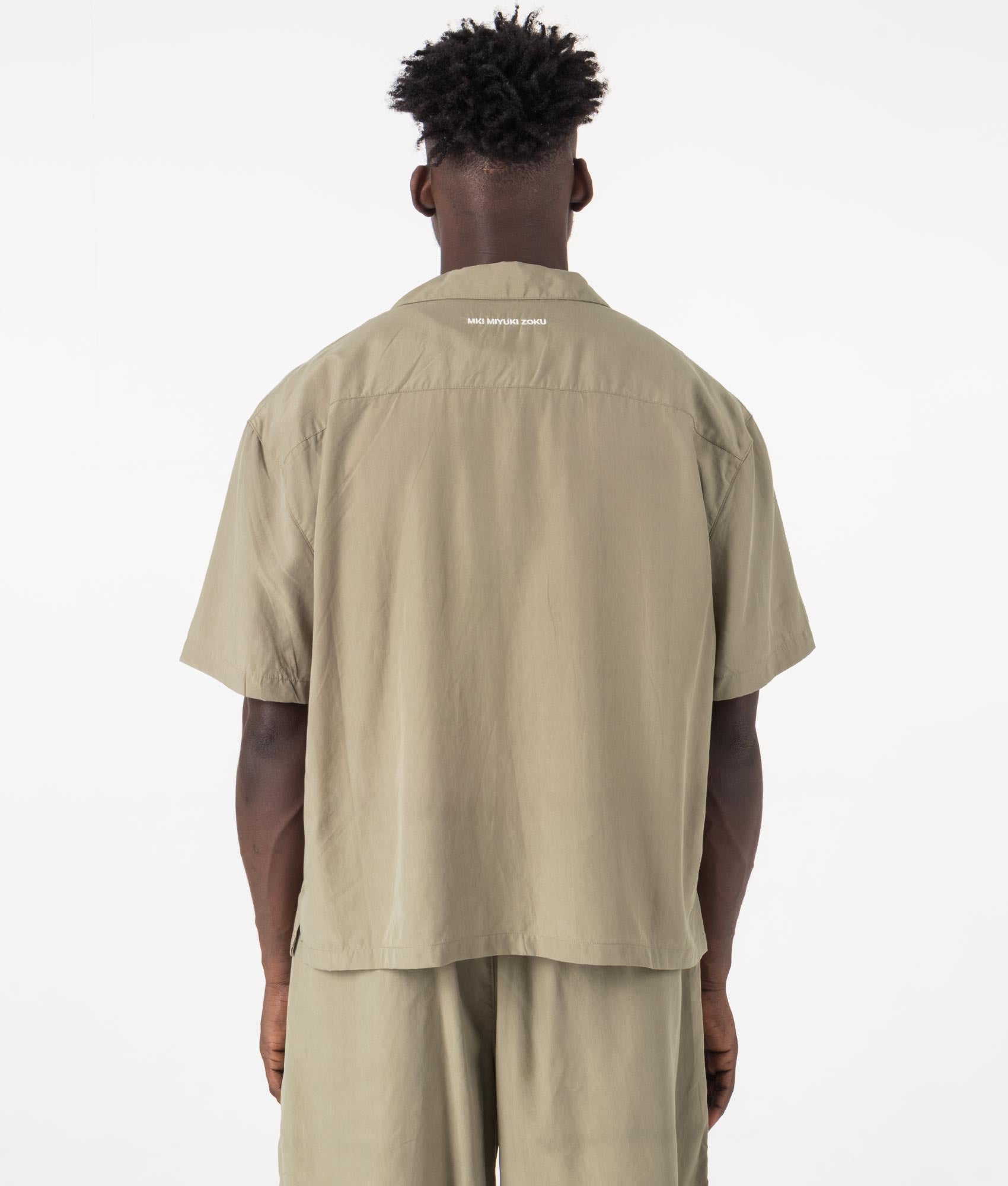 MKI Oversized Tencel Vacation Shirt in Sage Green. Back angle model shot at EQVVS.