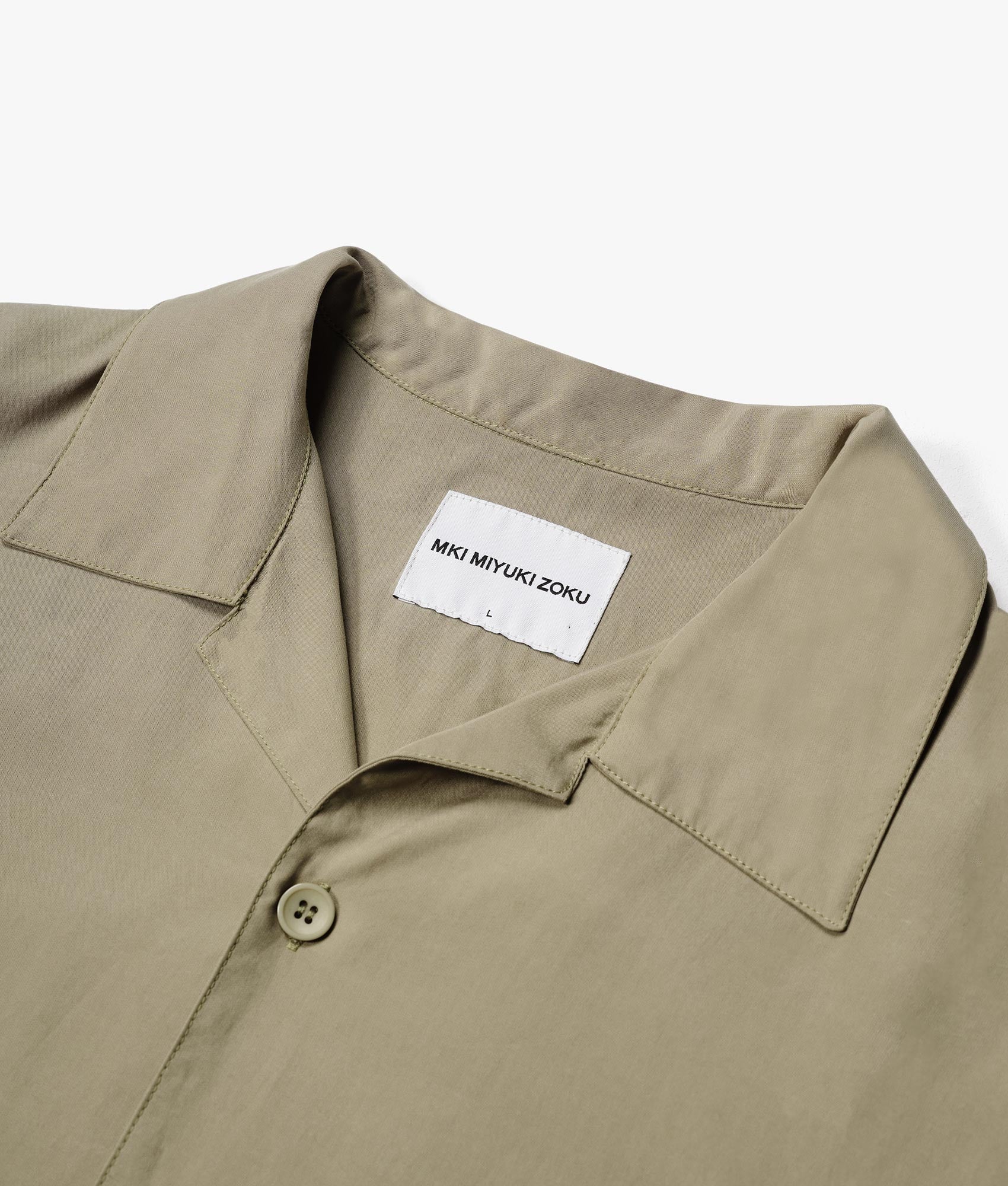 Oversized Tencel Vacation Shirt in Sage Green by MKI MIYUKI ZOKU. EQVVS Close up Collar Flat Shot. 