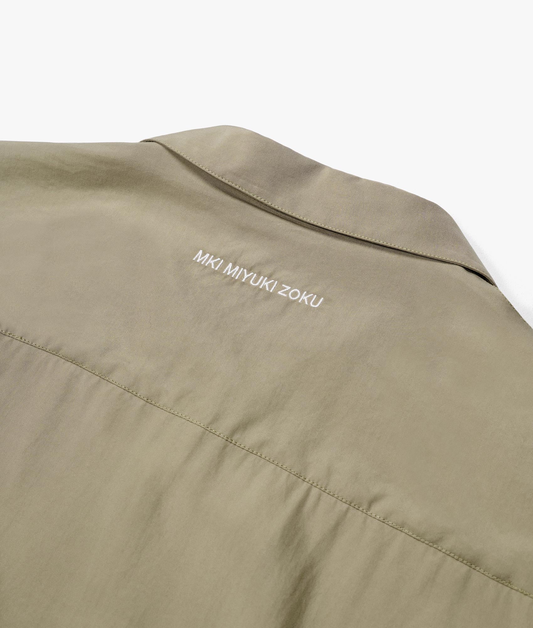 Oversized Tencel Vacation Shirt in Sage Green by MKI MIYUKI ZOKU. EQVVS Close Up Back Detail Flat Shot. 