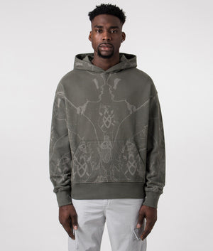 Daily Paper Relaxed Fit Secret Rhythm Hoodie in Chimera Green with Graphic Print Front Model Shot at EQVVS