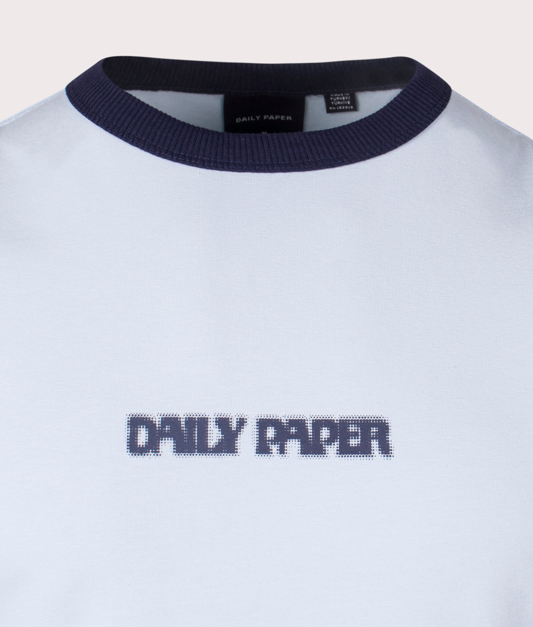 Dotted Type T-Shirt in Subdued Blue by Daily Paper. Shot at EQVVS. Detail shot. 