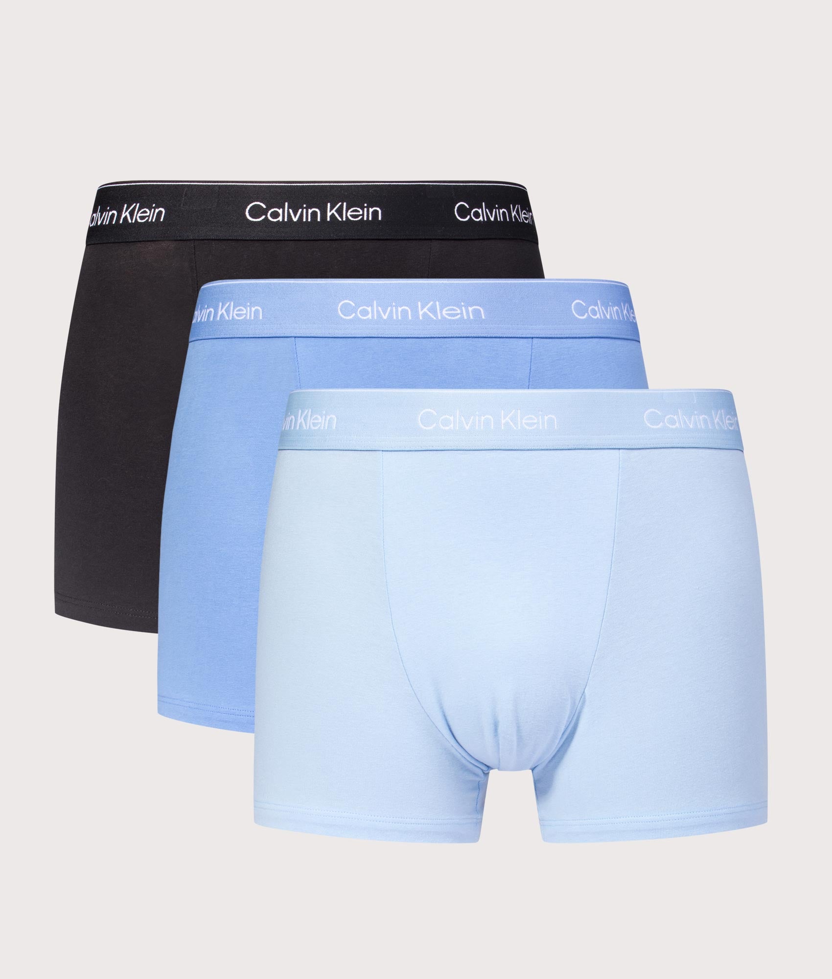 Calvin Klein 3 Pack Relaxed Fit Trunks in Black, Glacier and Blue Bell at EQVVS Menswear. Front shot.