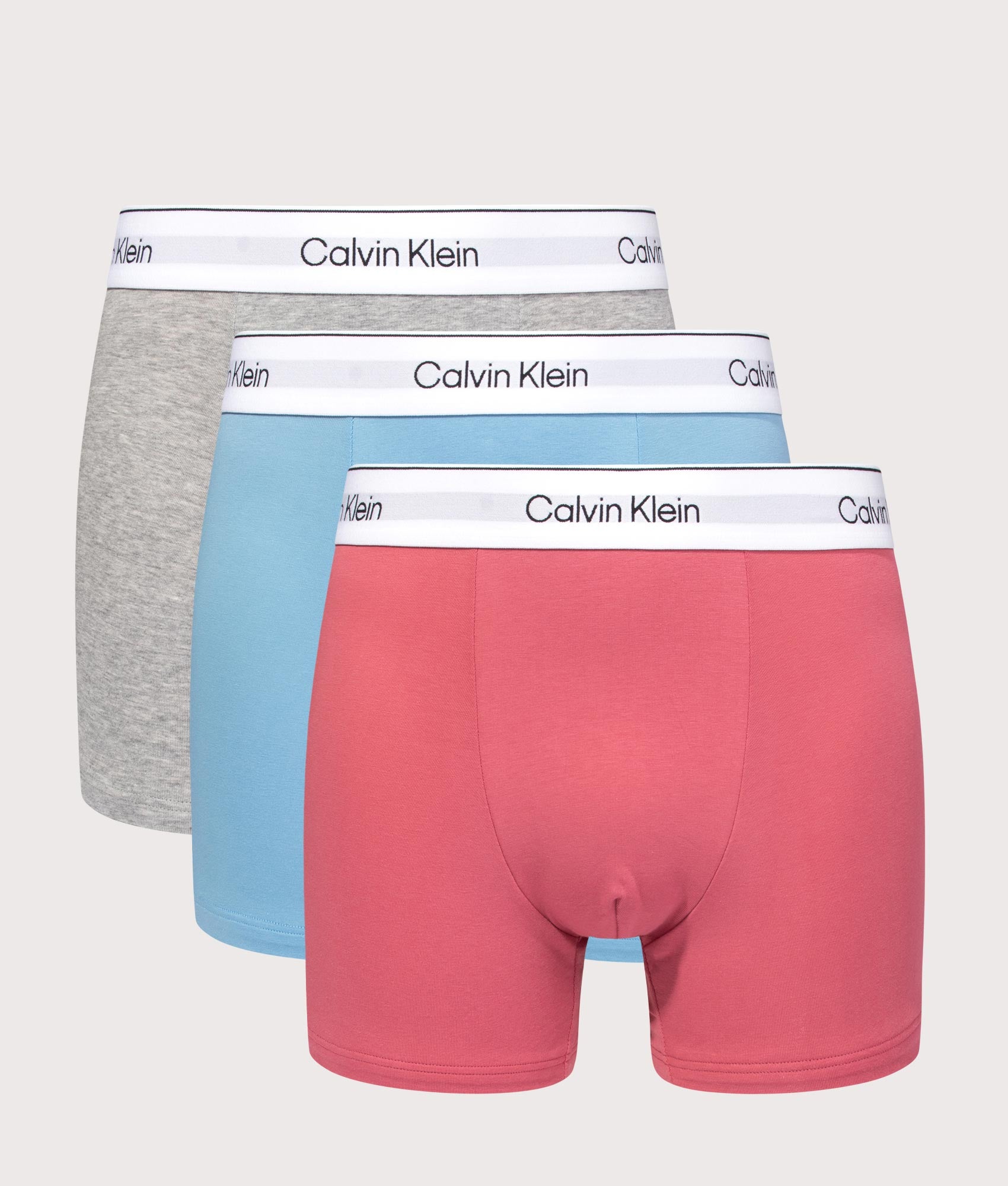 Calvin Klein 3 Pack Relaxed Fit Trunks in Brilliant Pink, Gulf Blue and Grey Heath. Front shot.