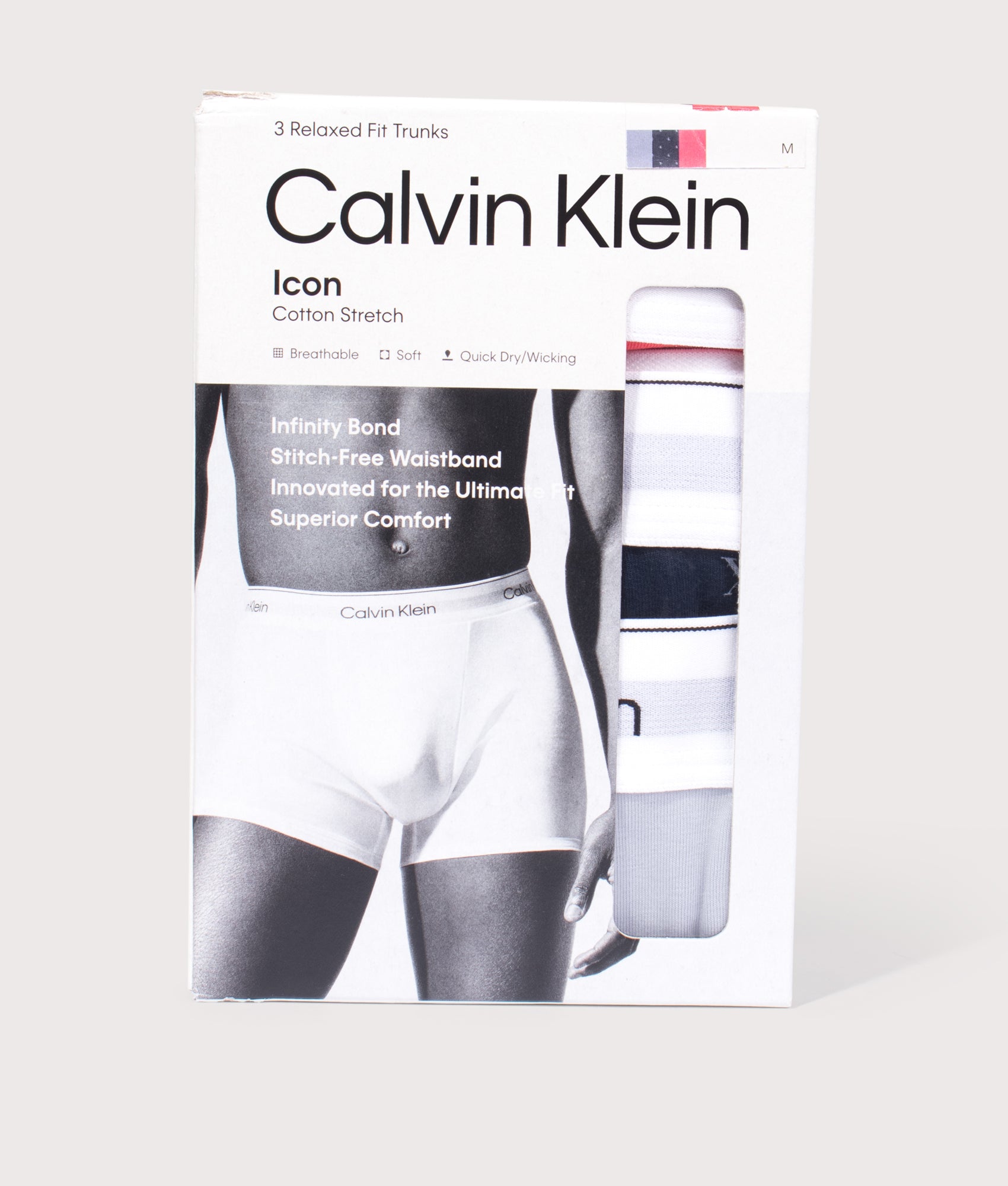 3 Pack Relaxed Fit Trunks in Misty Grey/Diamond Logo Shoreline/P by Calvin Klein. Shot by EQVVS. Packaging shot.