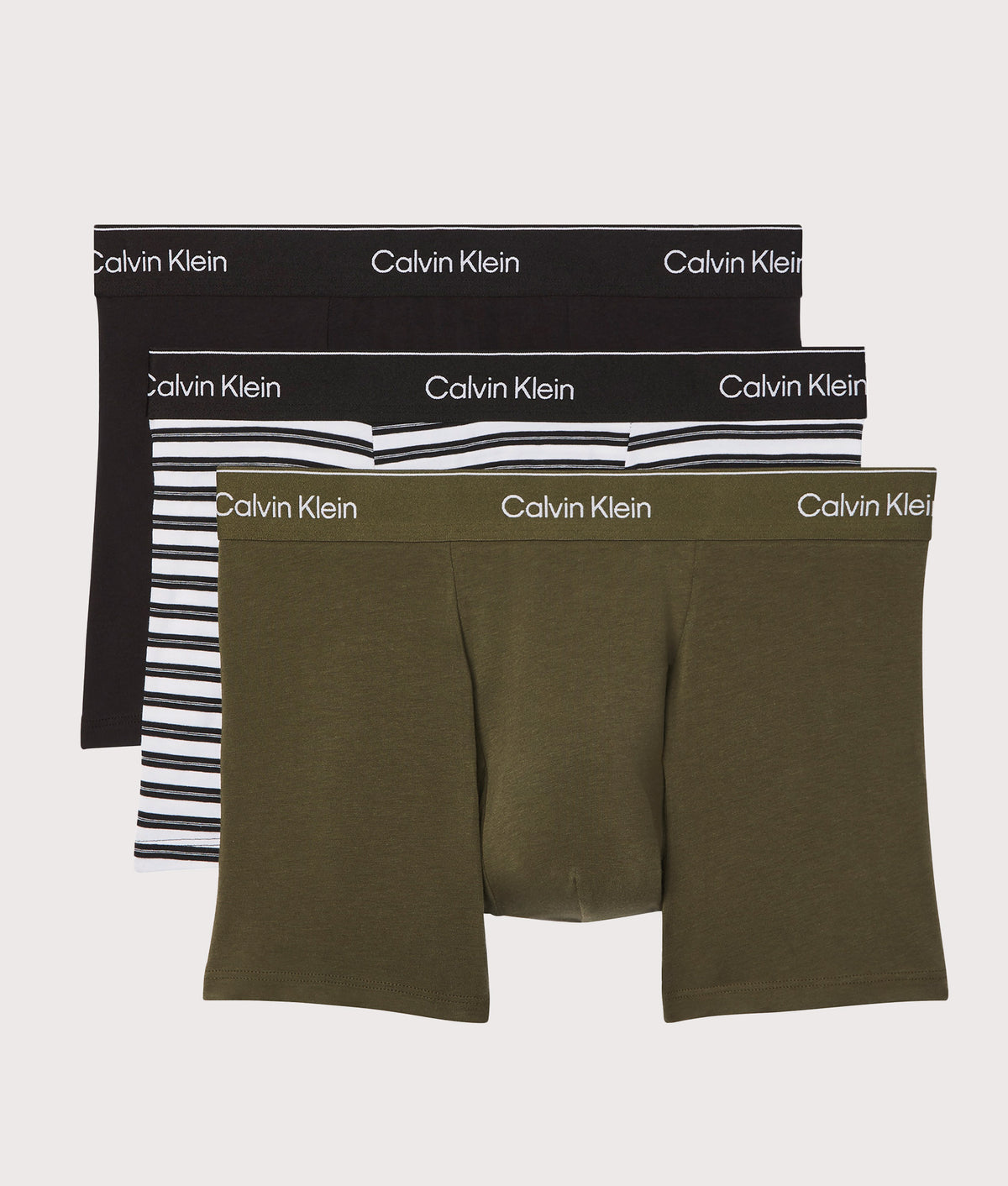 Calvin Klein 3 Pack Relaxed Fit Trunks in Black, Triple Black and Olive Night at EQVVS Menswear. Front shot.