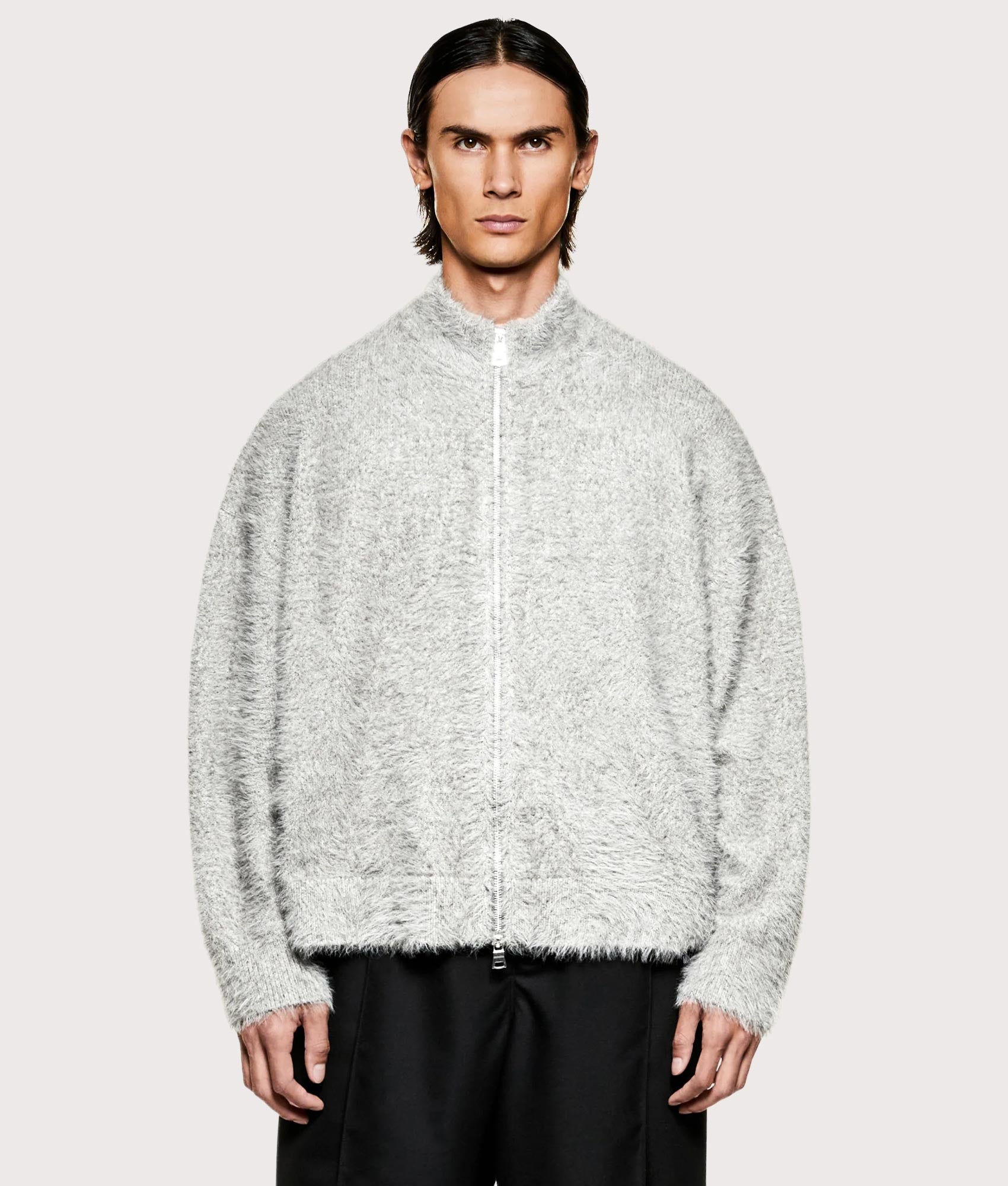 MKI MIYUKI ZOKU Faux Alpaca Knit Track Jacket in Charcoal Melange at EQVVS Menswear. Model front shot.