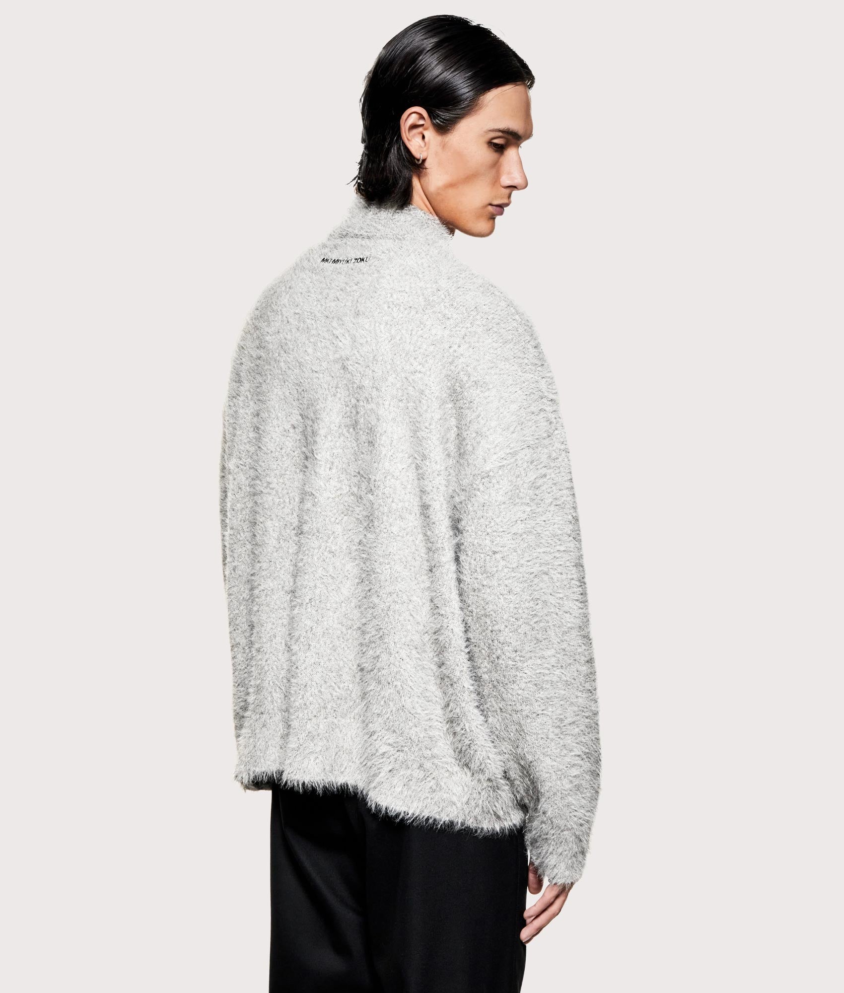 MKI MIYUKI ZOKU Faux Alpaca Knit Track Jacket in Charcoal Melange at EQVVS Menswear. Angled back shot.